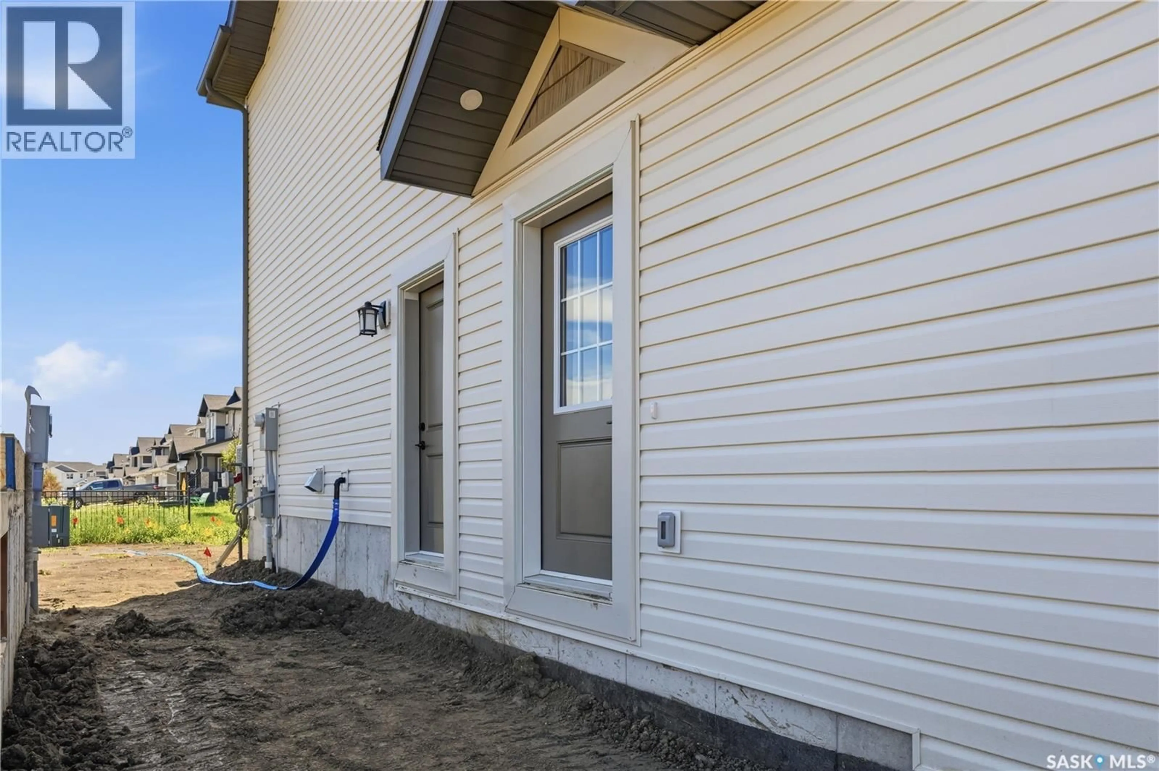 Home with vinyl exterior material, street for 1749 MUSTARD STREET, Regina Saskatchewan S4Y0G1