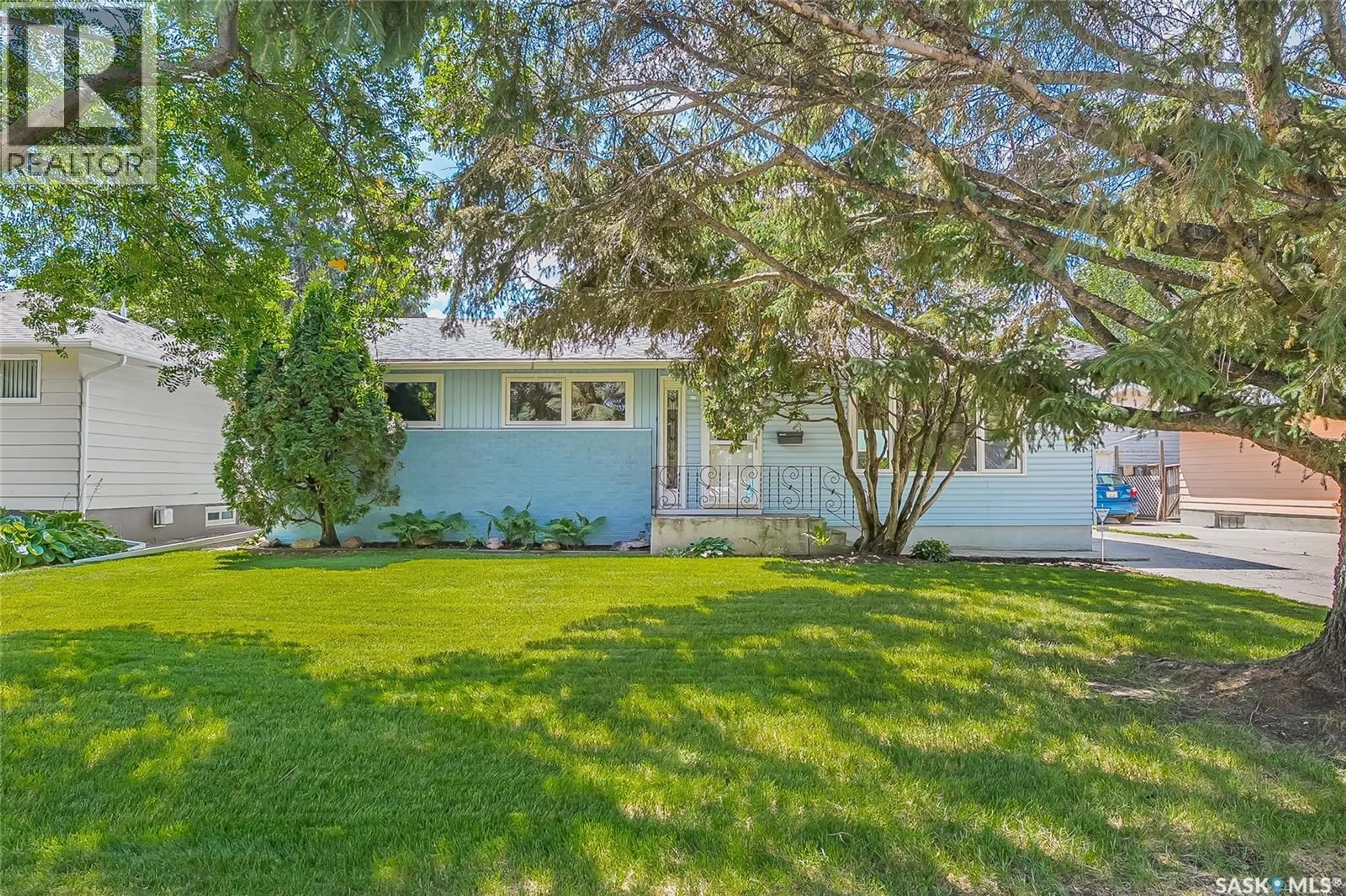 Home with vinyl exterior material, street for 310 ADELAIDE STREET E, Saskatoon Saskatchewan S7J0H7