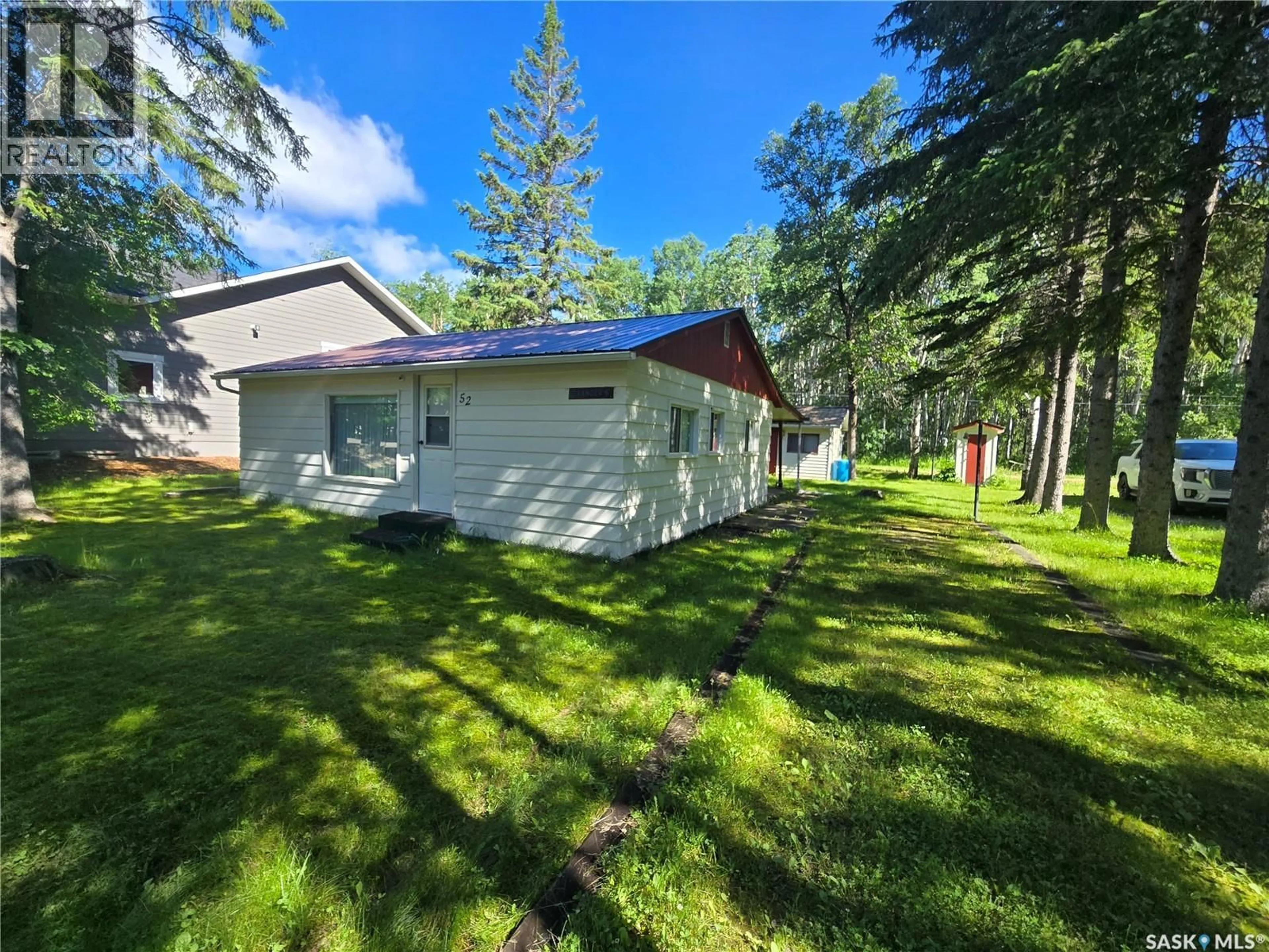 A pic from outside/outdoor area/front of a property/back of a property/a pic from drone, forest/trees view for 52 ASPEN CRESCENT, Moose Mountain Provincial Park Saskatchewan S0C2S0