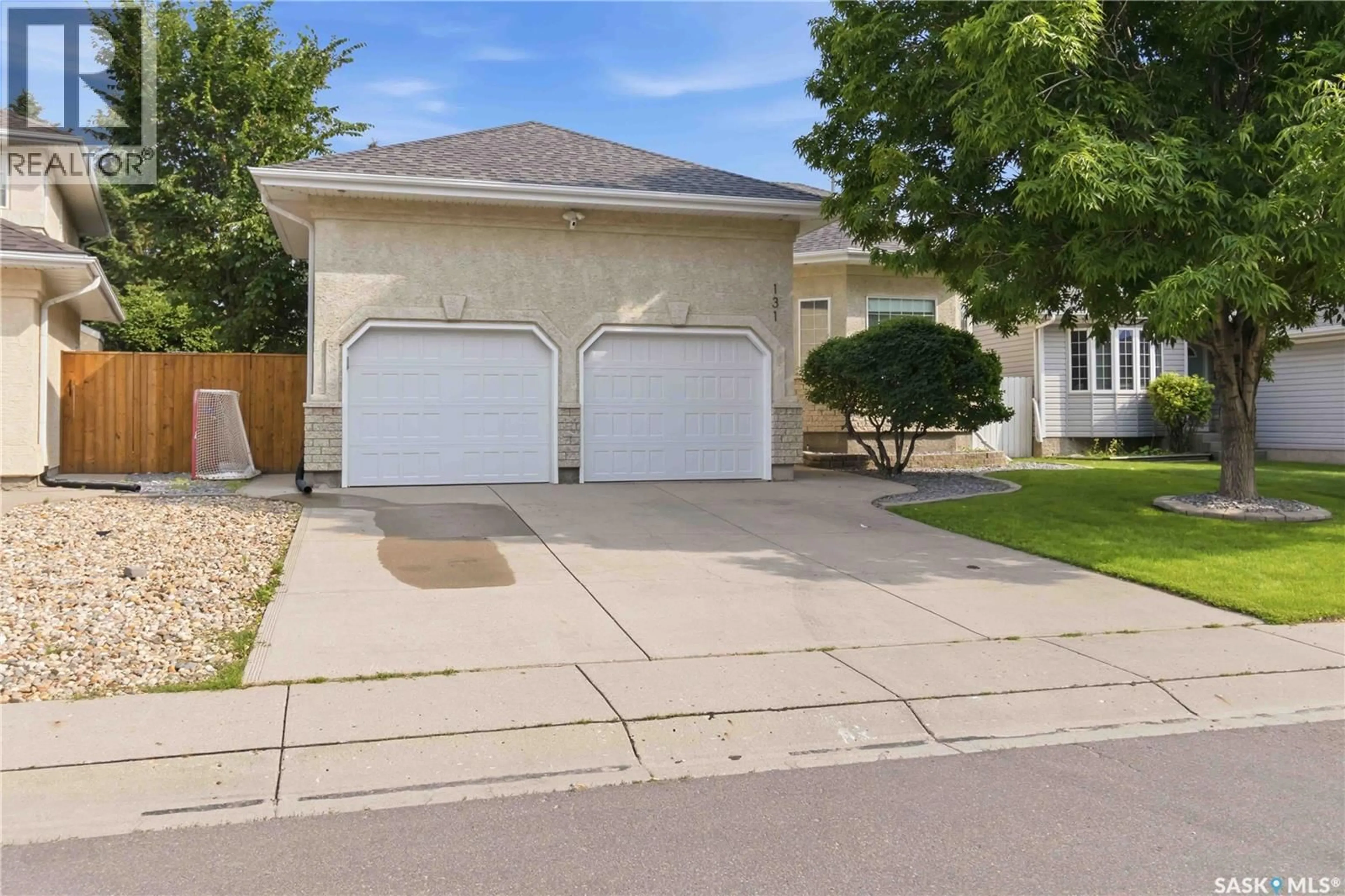 Home with vinyl exterior material, street for 131 MENDEL CRESCENT, Saskatoon Saskatchewan S7J5J7