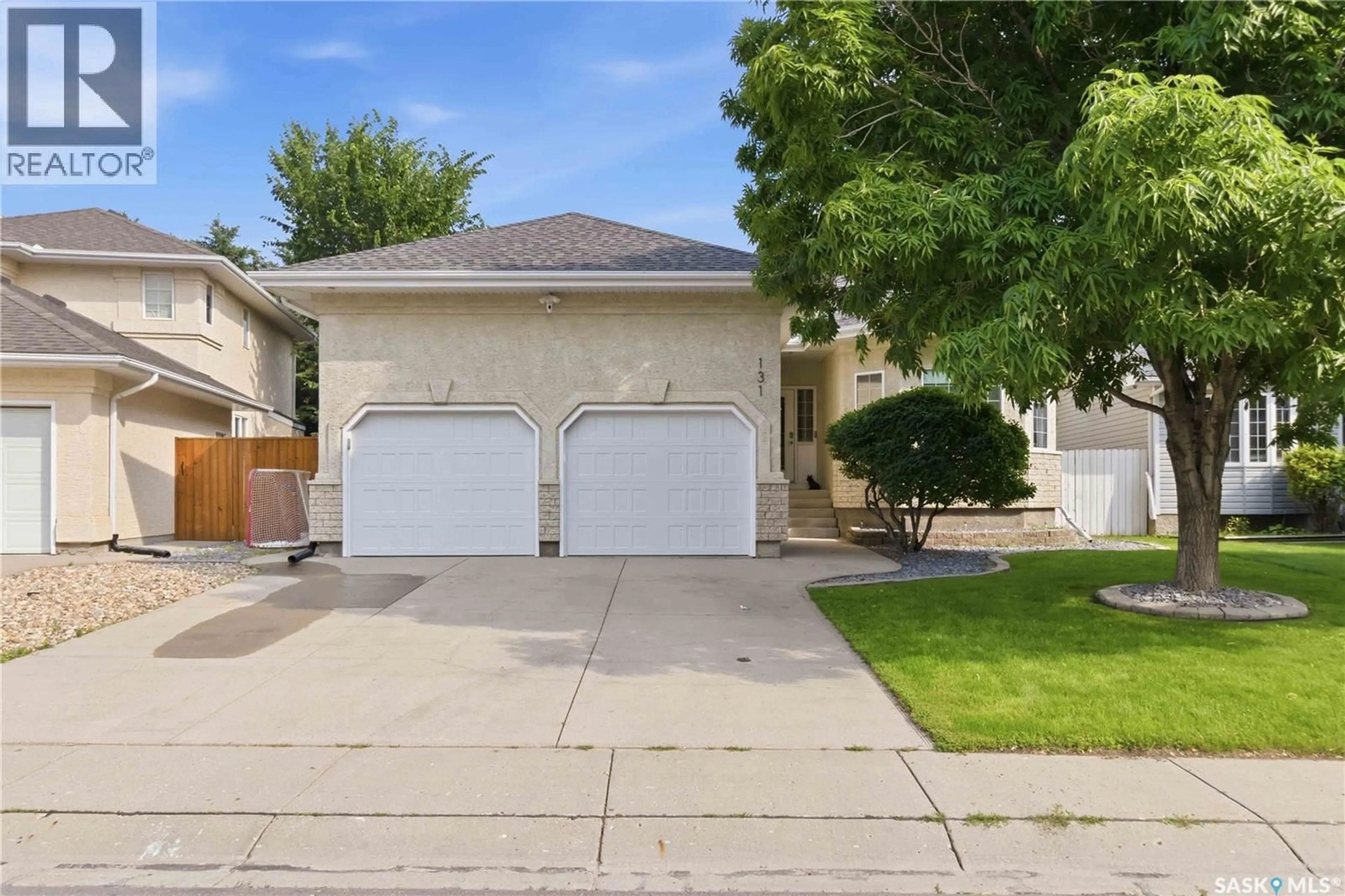 Home with vinyl exterior material, street for 131 MENDEL CRESCENT, Saskatoon Saskatchewan S7J5J7