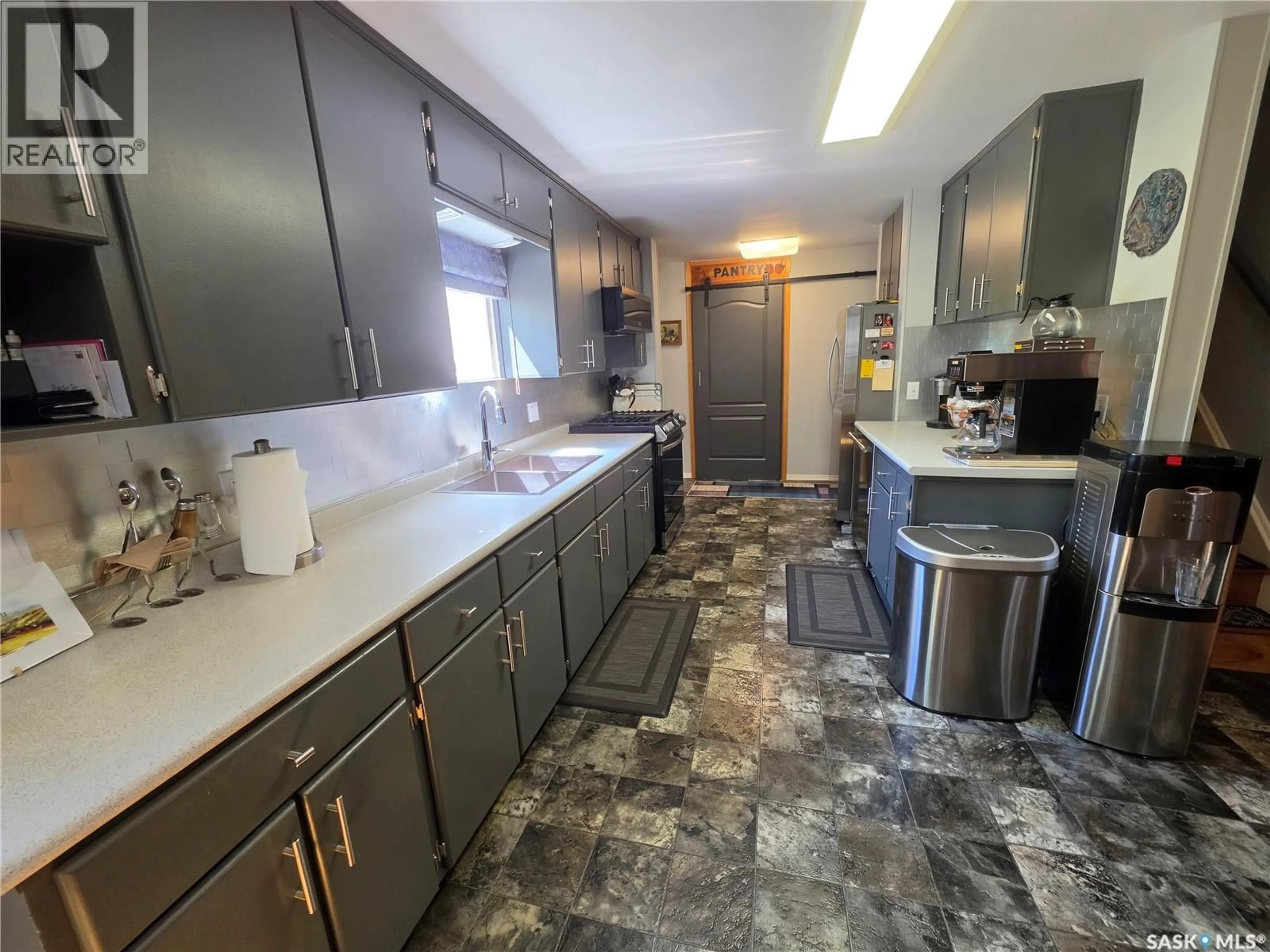Kitchen with laundary machines, ceramic/tile floor for 5 OLSON AVENUE, Meadow Lake Rm No.588 Saskatchewan S0M2M0