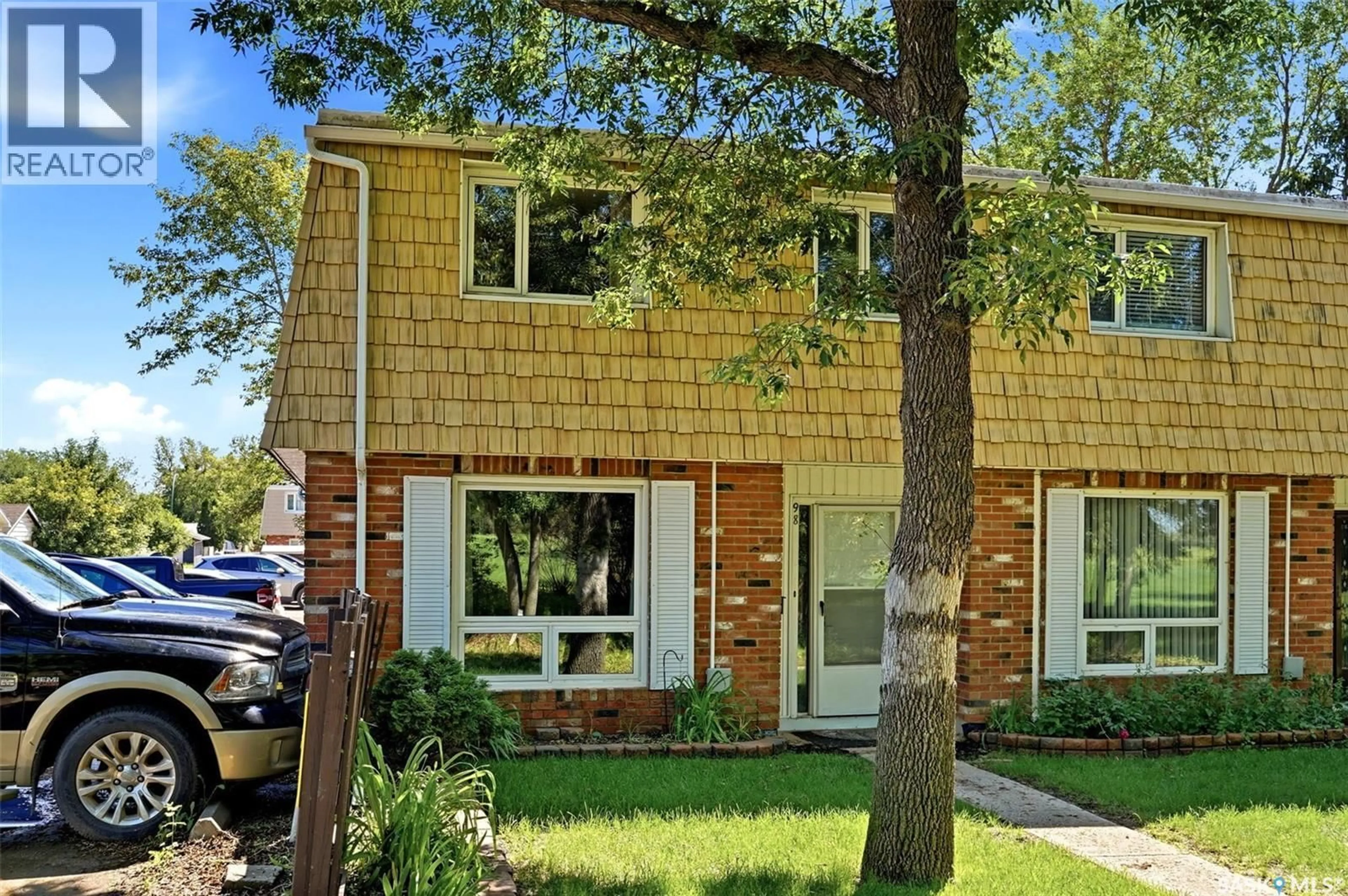 Home with brick exterior material, street for 98 OAKVIEW DRIVE, Regina Saskatchewan S4R0E4