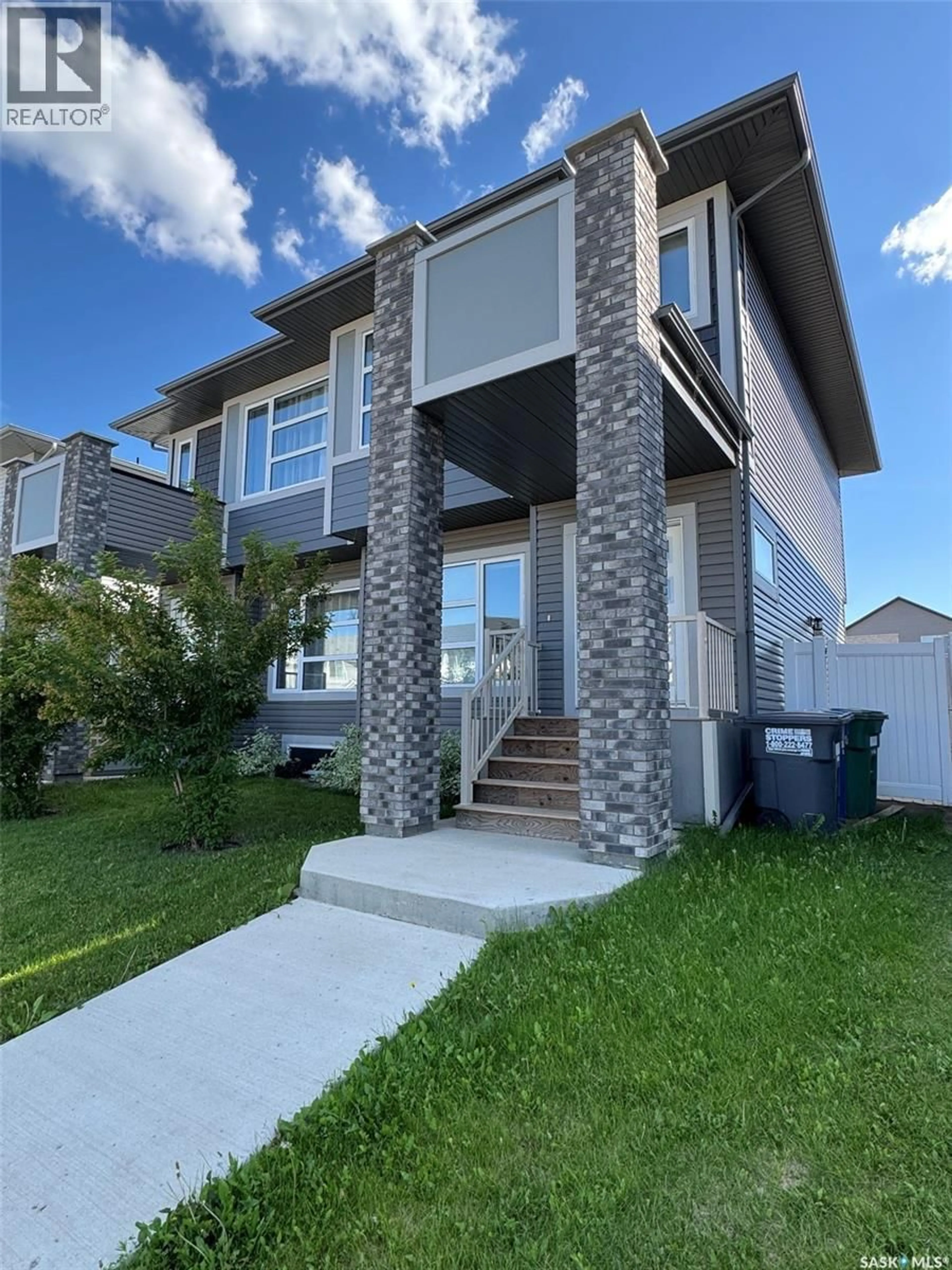 Home with vinyl exterior material, street for 266 BRIGHTON BOULEVARD, Saskatoon Saskatchewan S7V0V8
