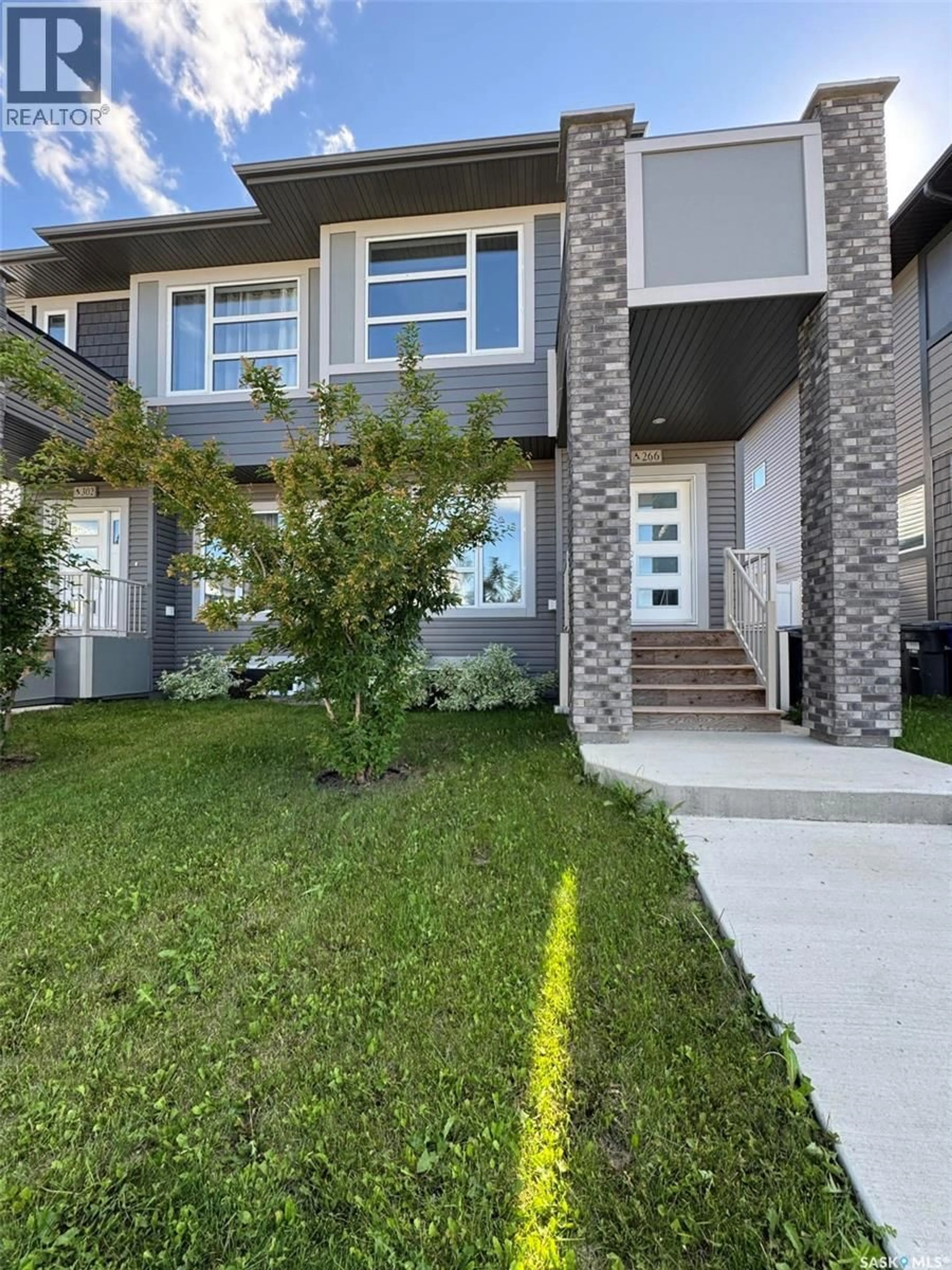 Home with brick exterior material, street for 266 BRIGHTON BOULEVARD, Saskatoon Saskatchewan S7V0V8