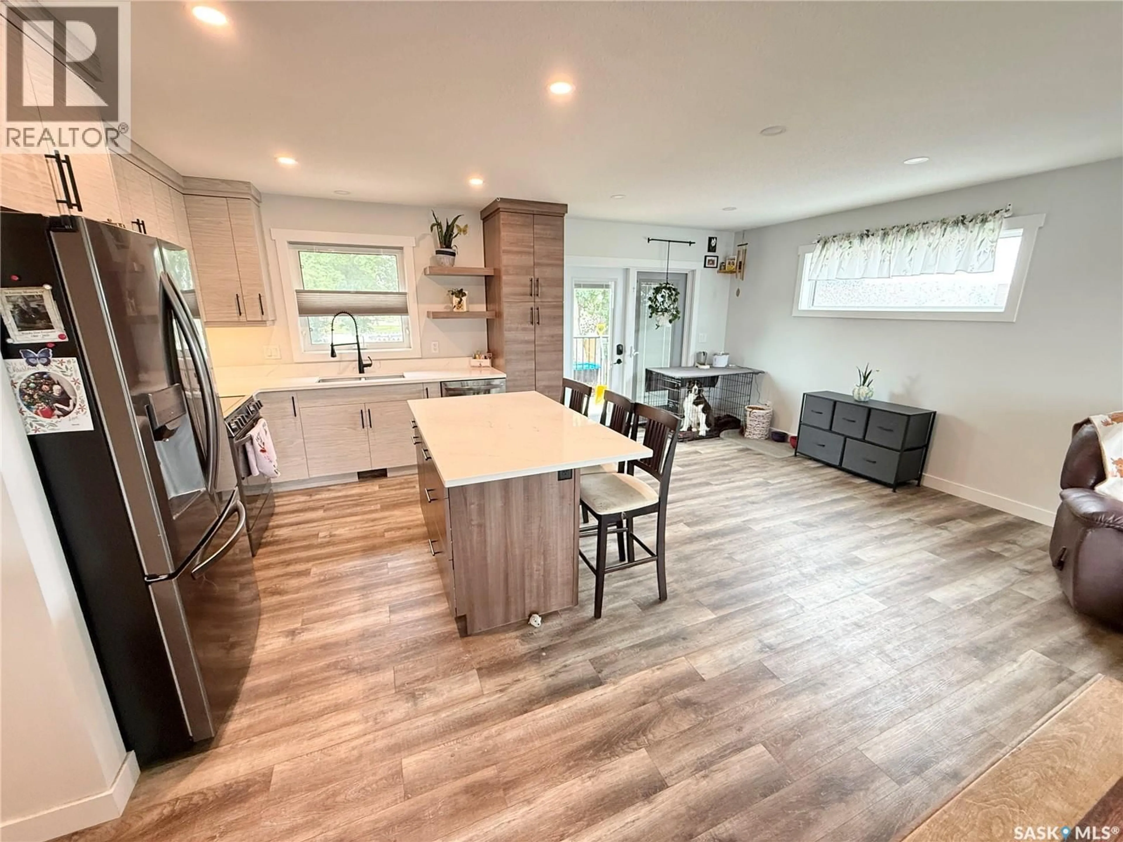 Open concept kitchen, wood/laminate floor for 44 MITCHELL CRESCENT, Weyburn Saskatchewan S4H2M4