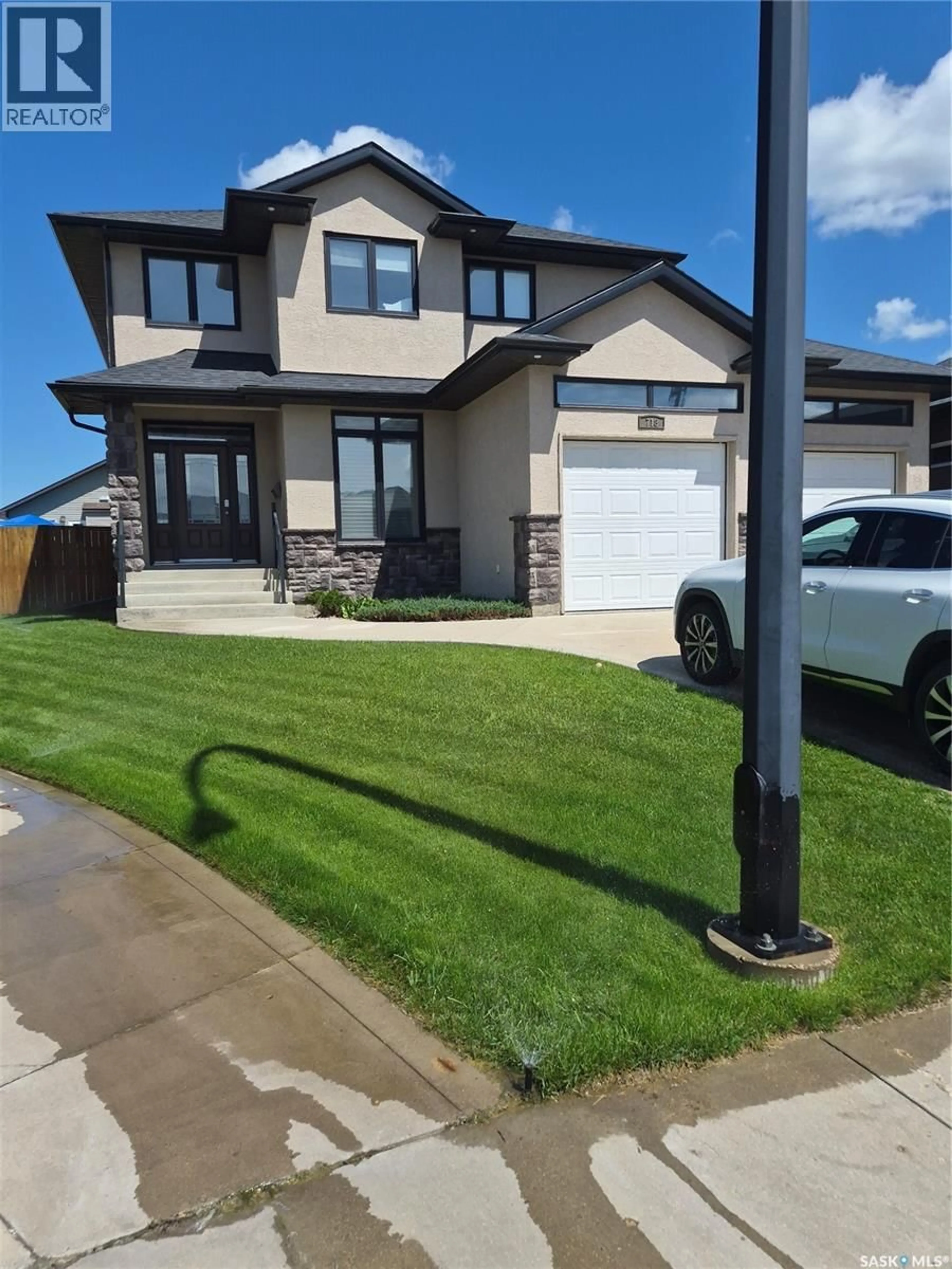 Home with vinyl exterior material, street for 718 PATRICK BAY, Saskatoon Saskatchewan S7W0G3