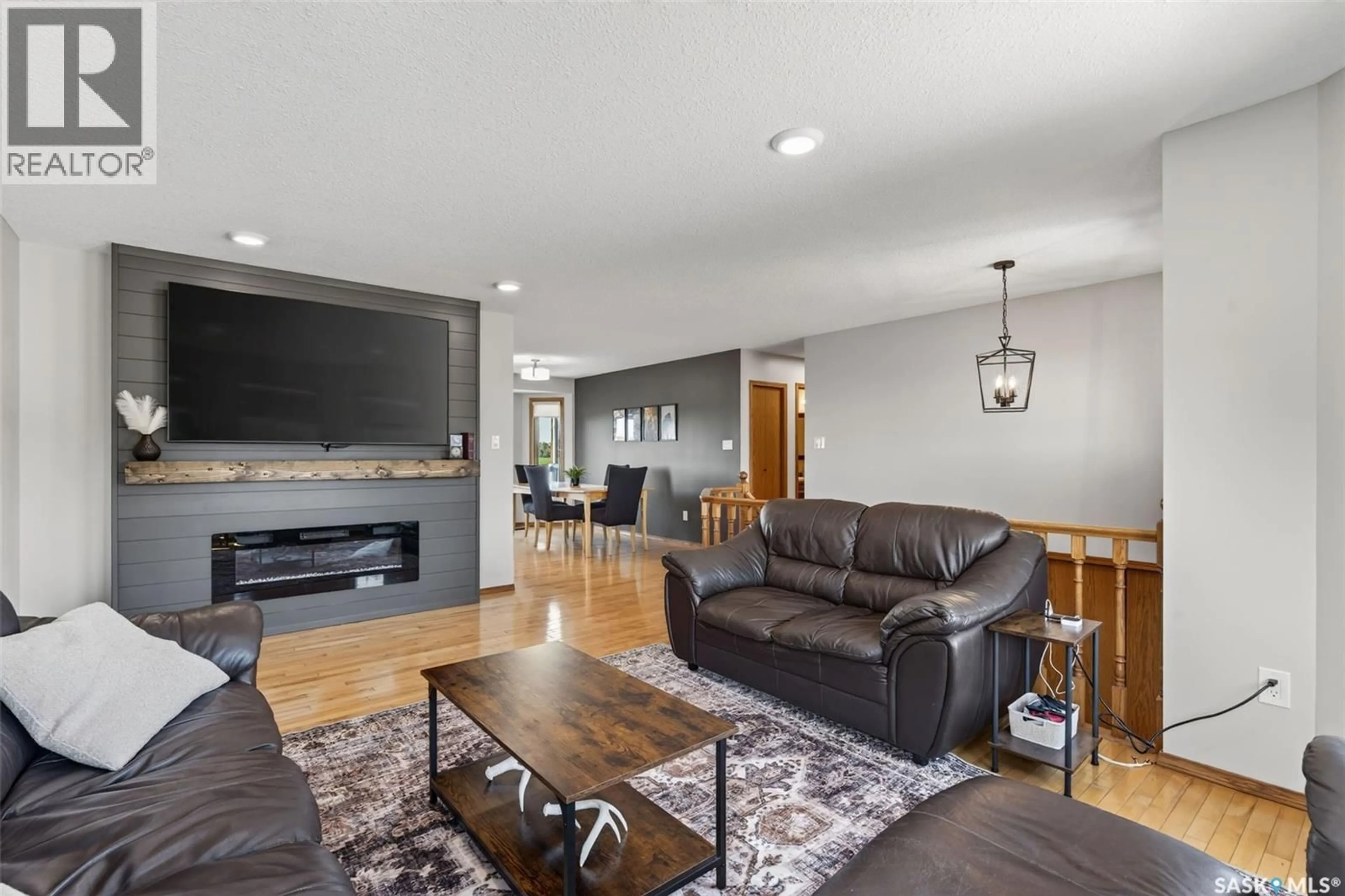 Living room with furniture, wood/laminate floor for 531 MAHON DRIVE, Prince Albert Saskatchewan S6V7Z8