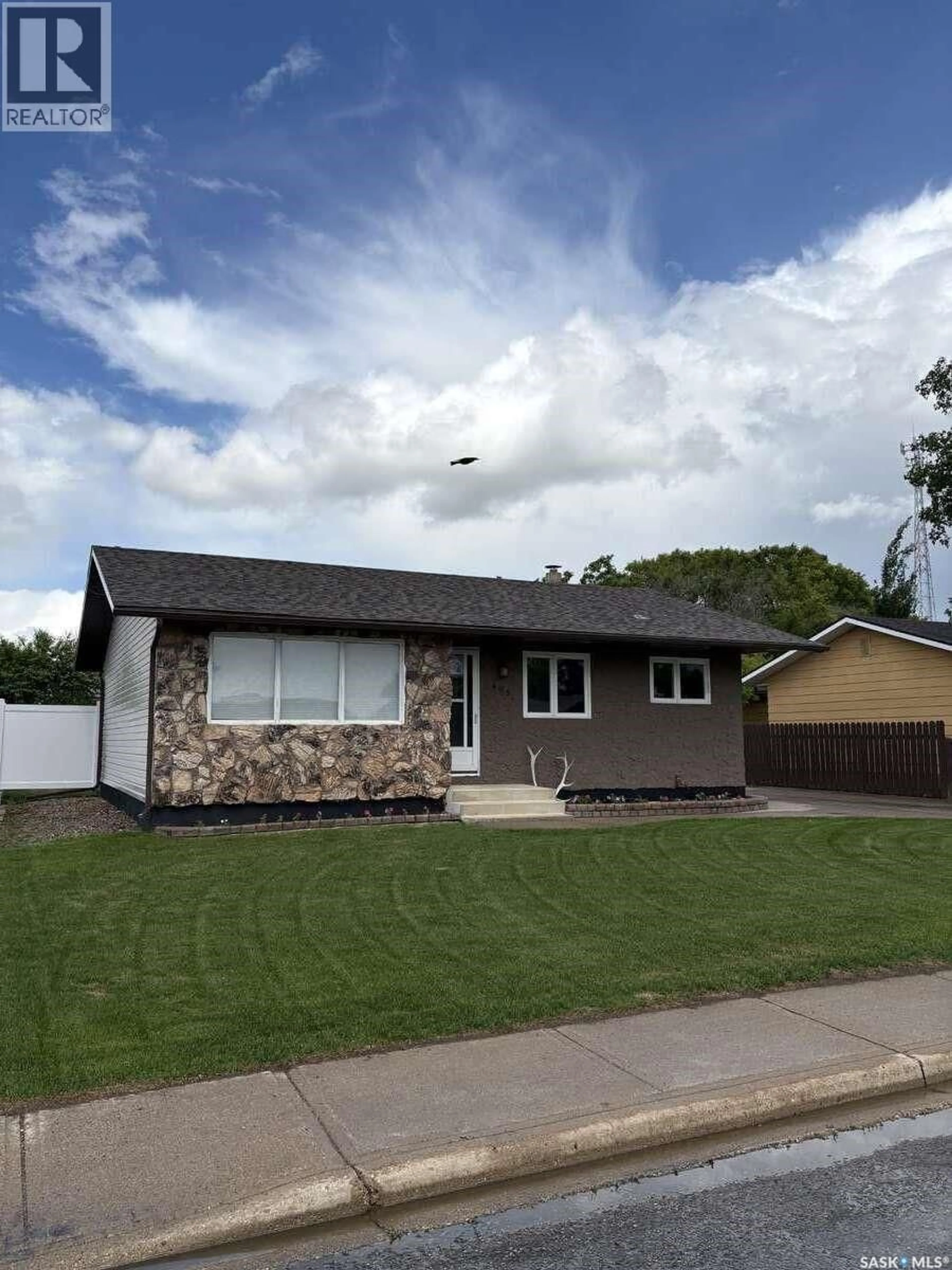 Home with vinyl exterior material, street for 405 7TH AVENUE, Biggar Saskatchewan S0K0M0