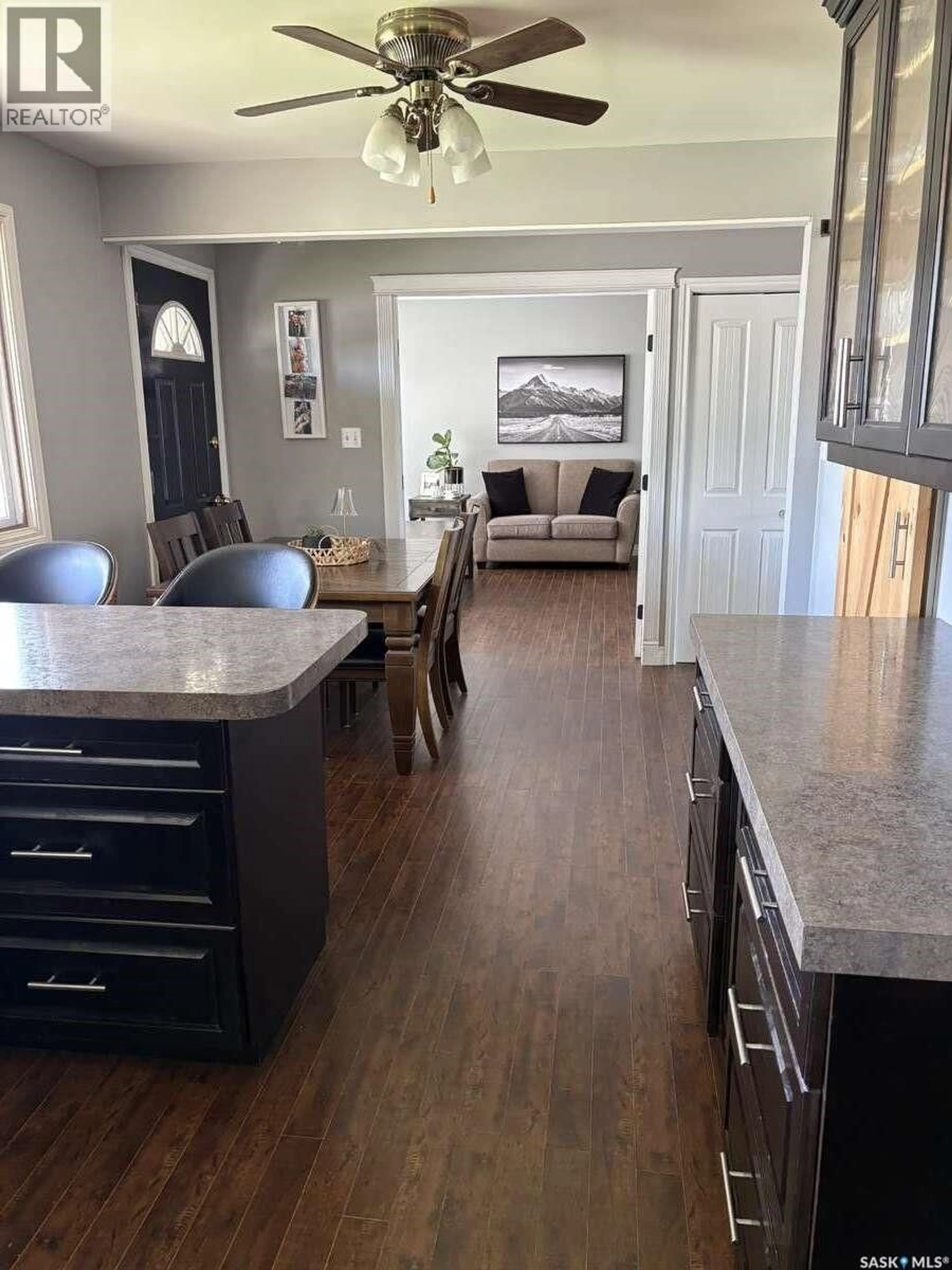 Open concept kitchen, wood/laminate floor for 405 7TH AVENUE, Biggar Saskatchewan S0K0M0