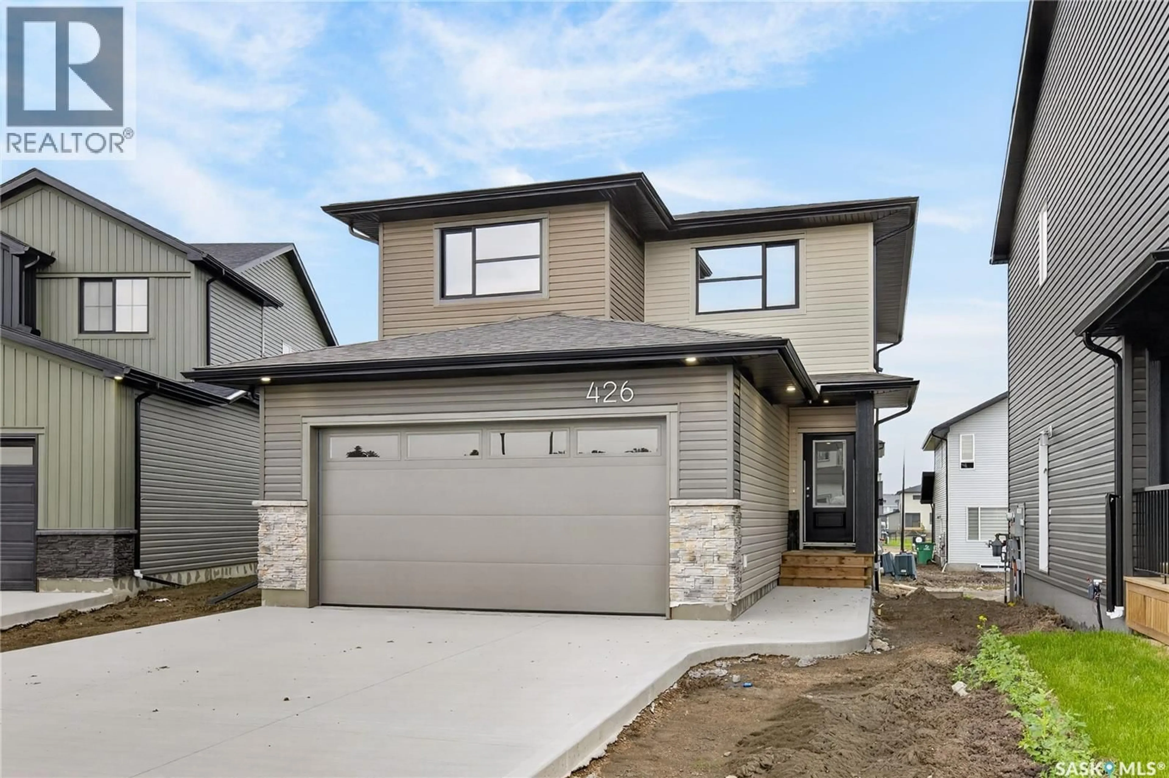 Home with brick exterior material, street for 426 COCKCROFT PLACE, Saskatoon Saskatchewan S7V1Y9
