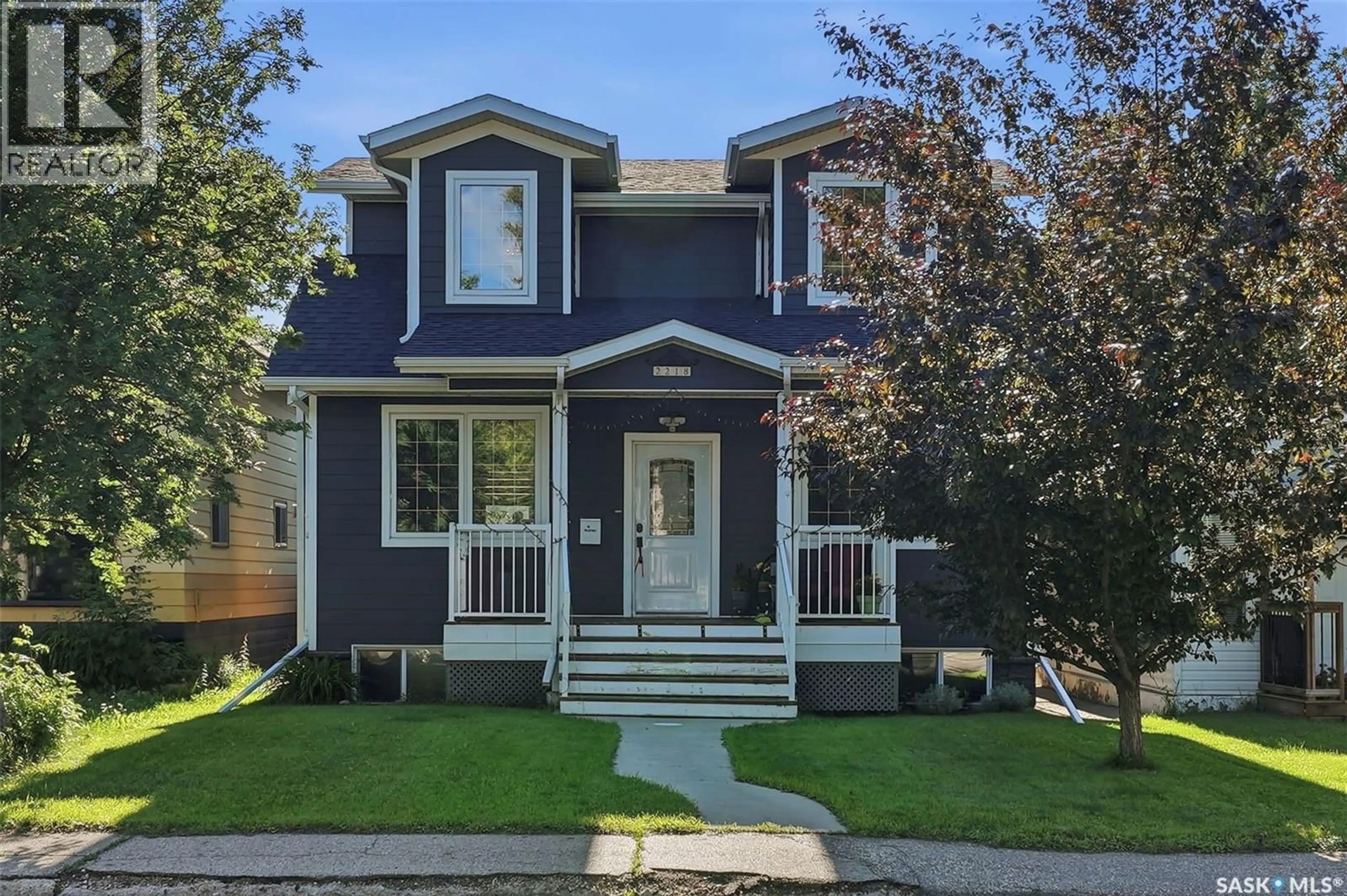 Home with vinyl exterior material, street for 2218 ST ANDREWS AVENUE, Saskatoon Saskatchewan S7M0M3
