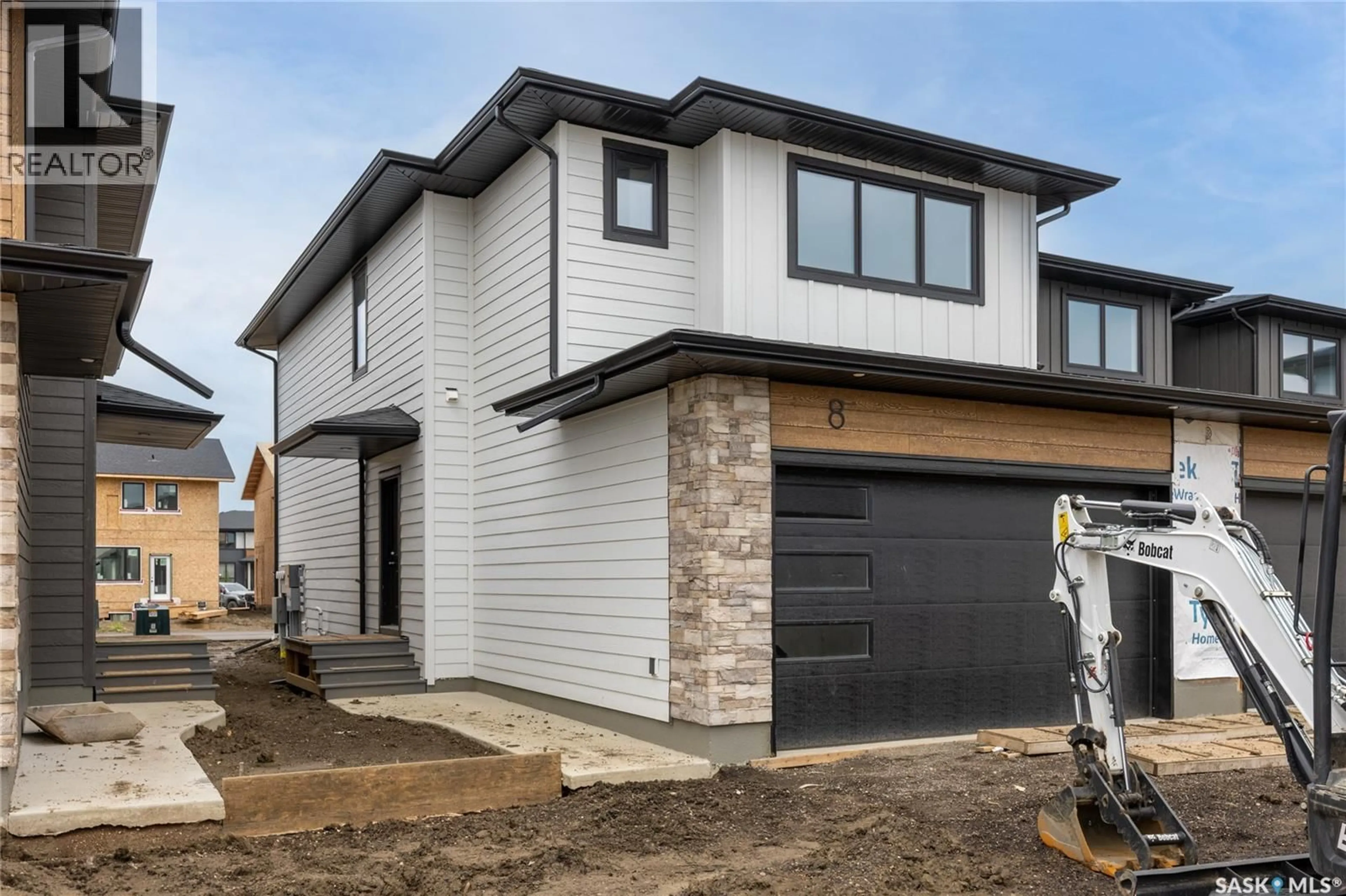 Home with brick exterior material, street for 8 - 830 BRIGHTON BOULEVARD, Saskatoon Saskatchewan S7V2A8