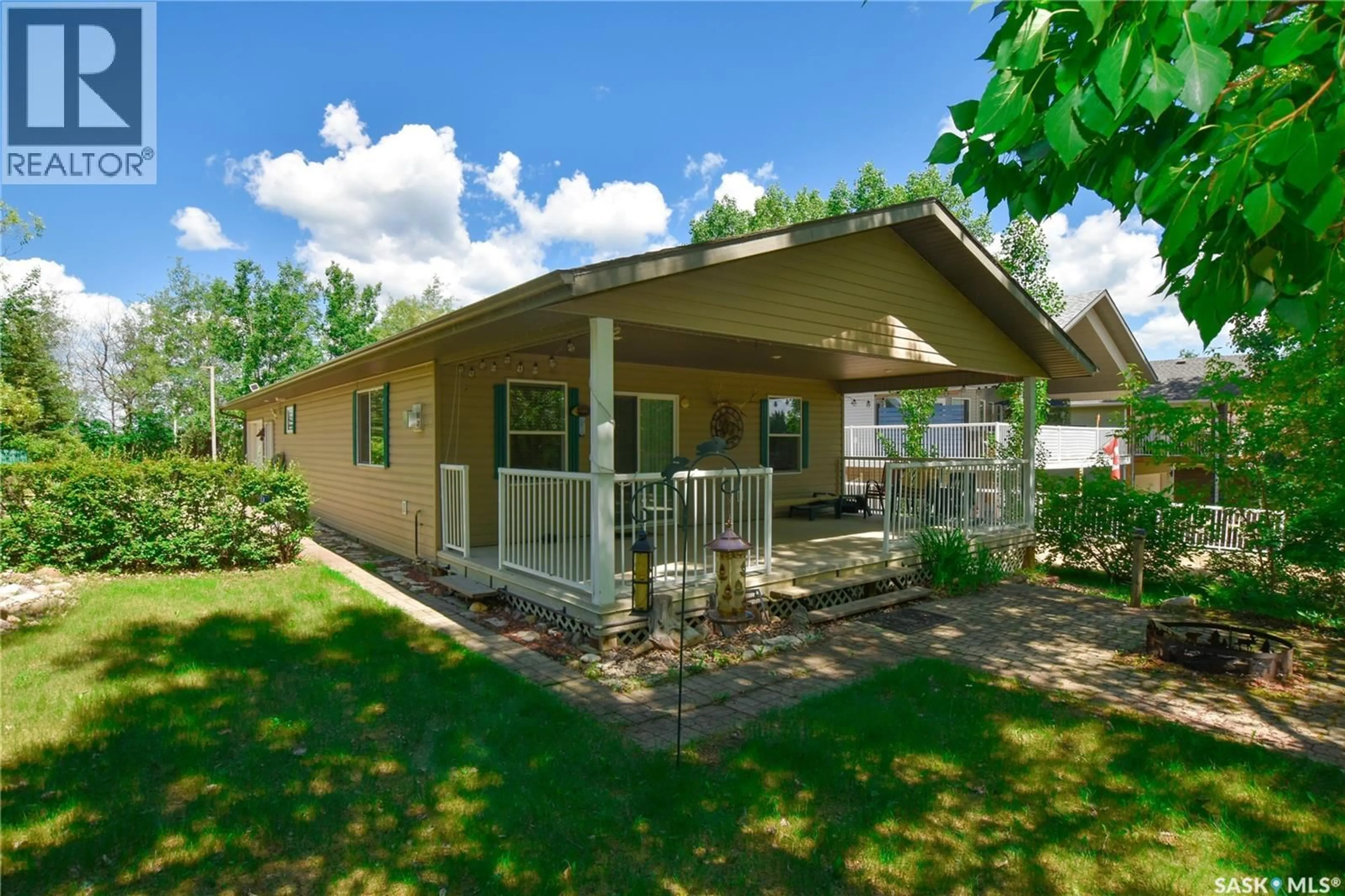 Home with vinyl exterior material, street for 134 SUNRIDGE ROAD, Pebble Baye Saskatchewan S0J2G0