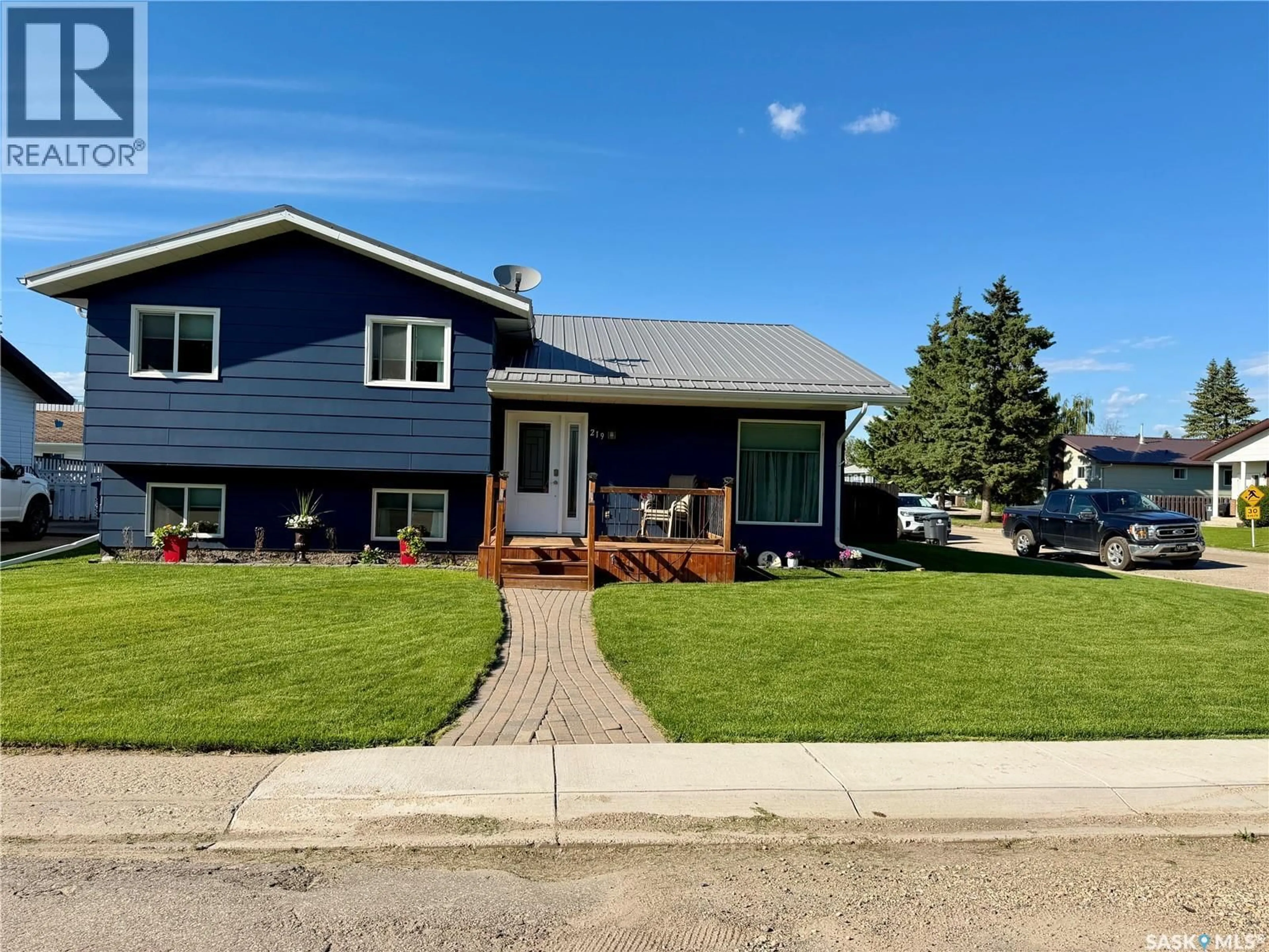 Home with vinyl exterior material, street for 219 4TH AVENUE, Spiritwood Saskatchewan S0J2M0