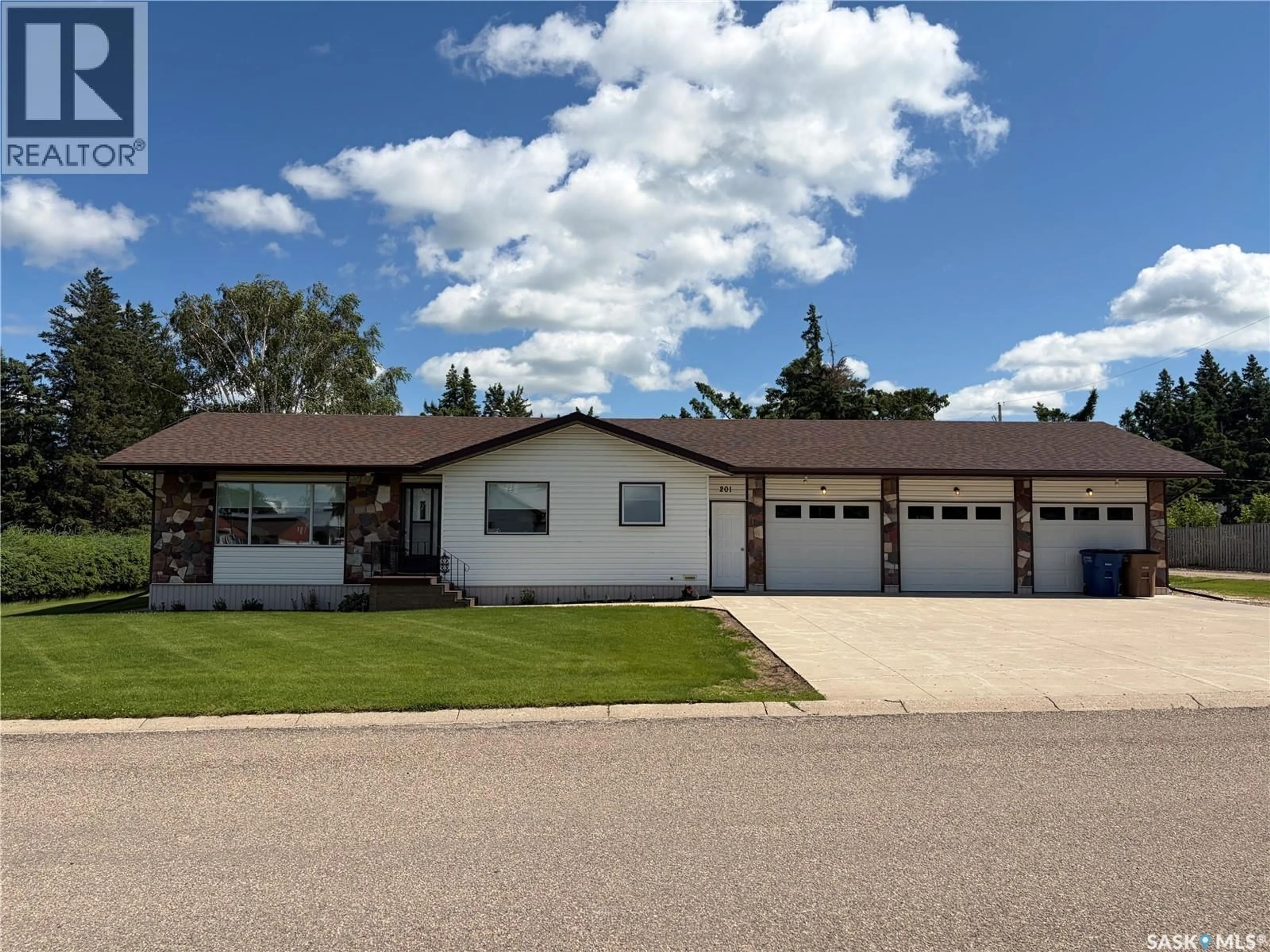 Home with vinyl exterior material, street for 201 1ST STREET, Kelvington Saskatchewan S0A1W0