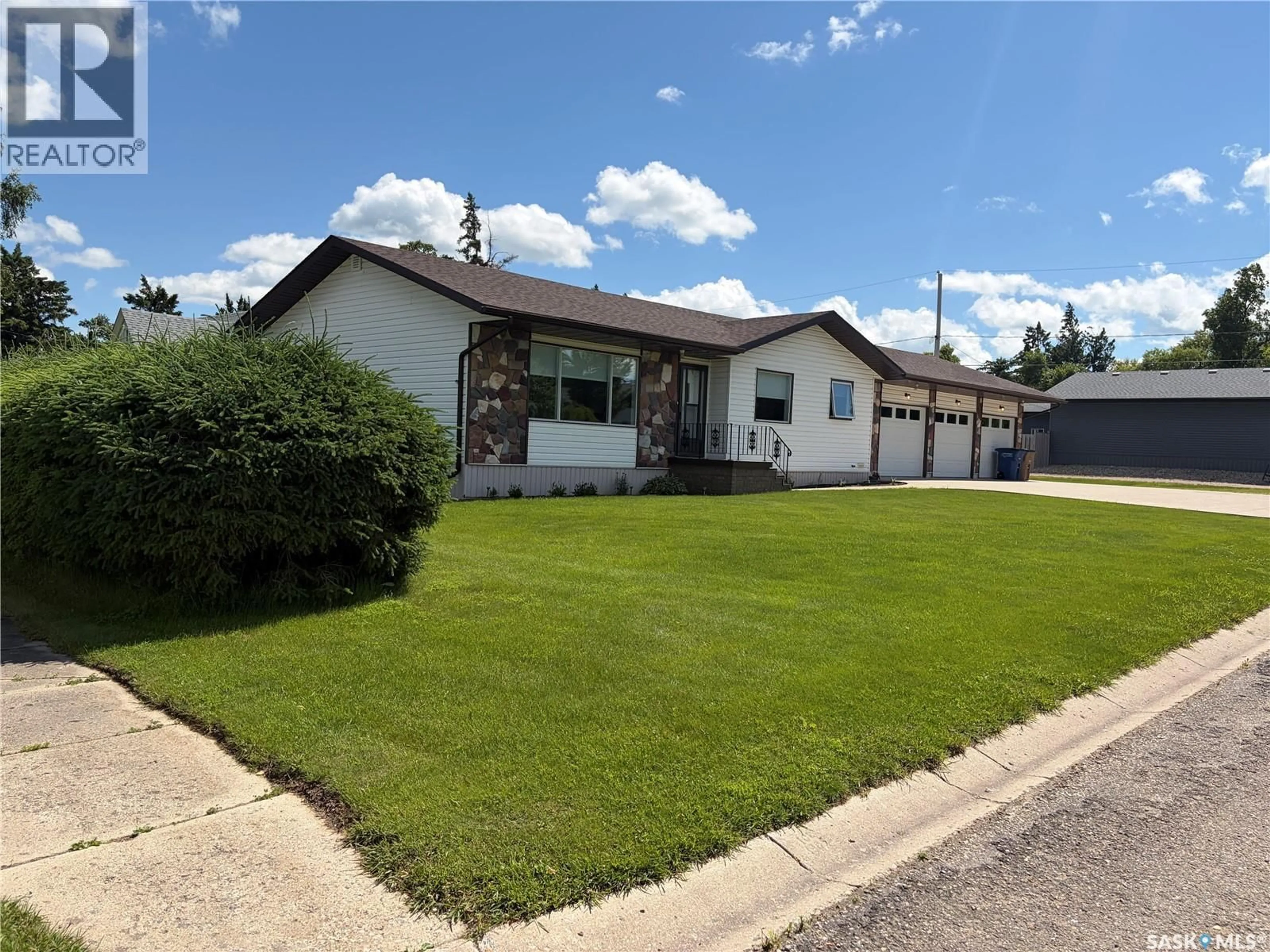 Home with vinyl exterior material, street for 201 1ST STREET, Kelvington Saskatchewan S0A1W0