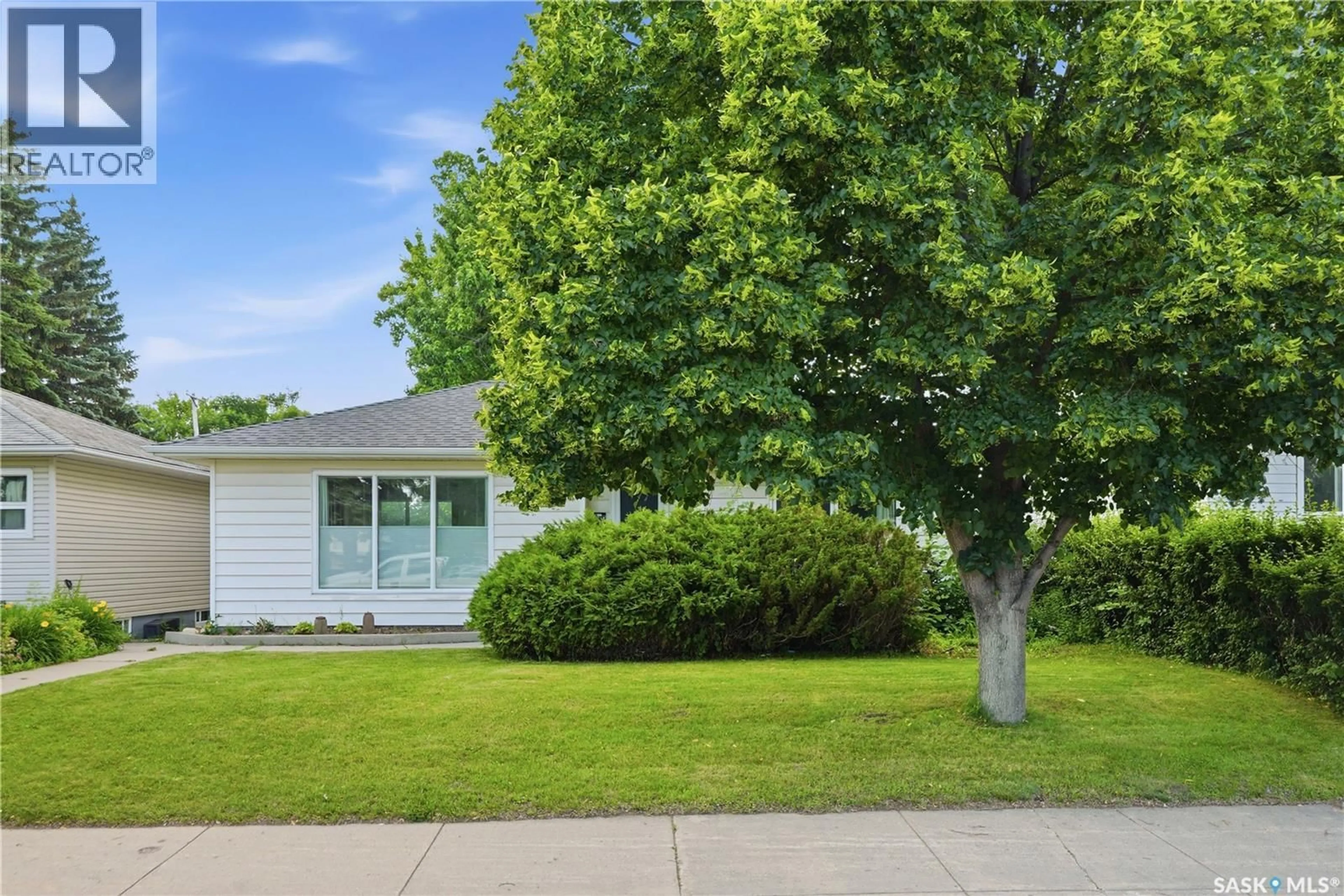 Home with vinyl exterior material, street for 2118 CLARENCE AVENUE, Saskatoon Saskatchewan S7J1L5