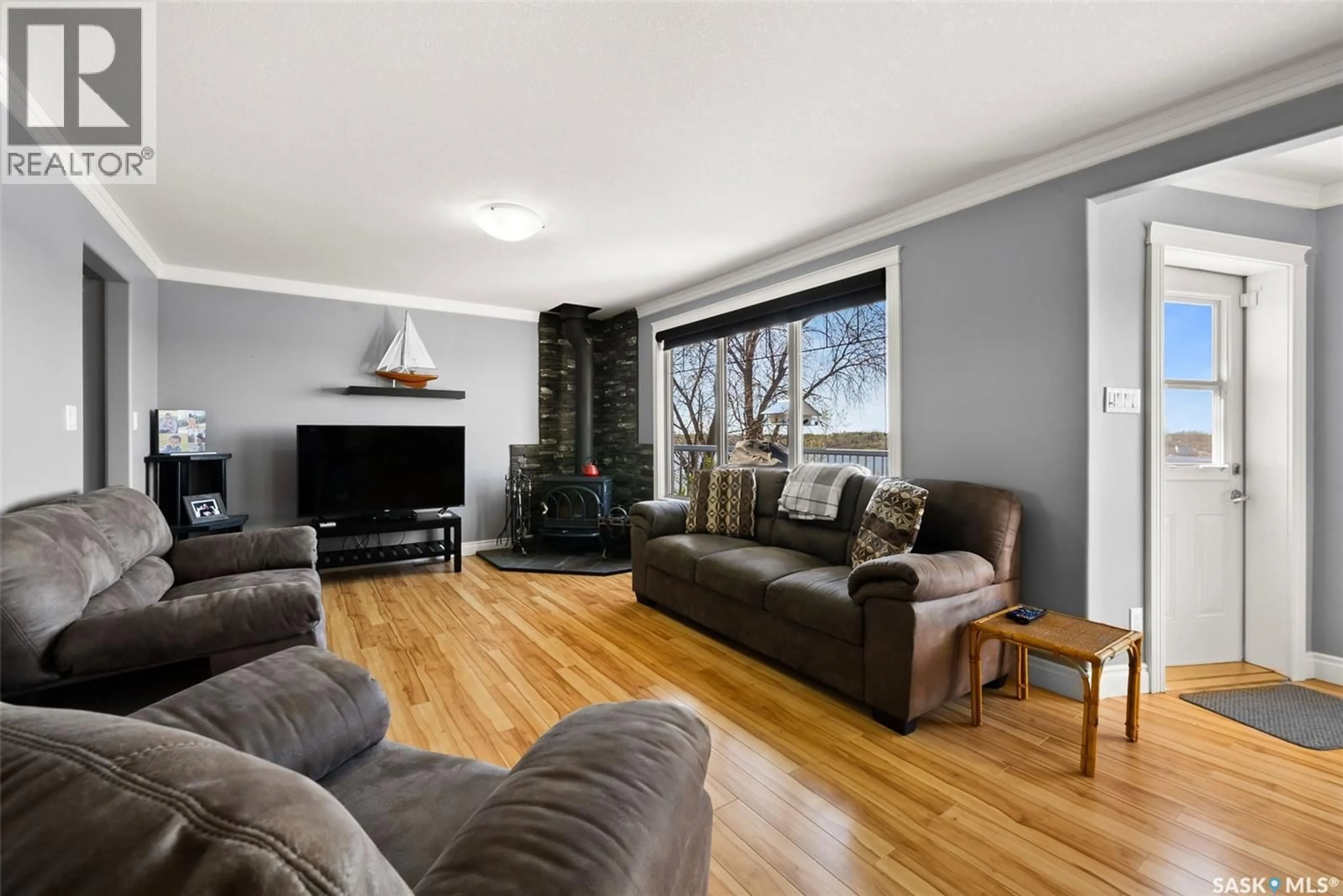 Living room with furniture, wood/laminate floor for 224 PICKEREL STREET, Mckillop Rm No. 220 Saskatchewan S0G4L0