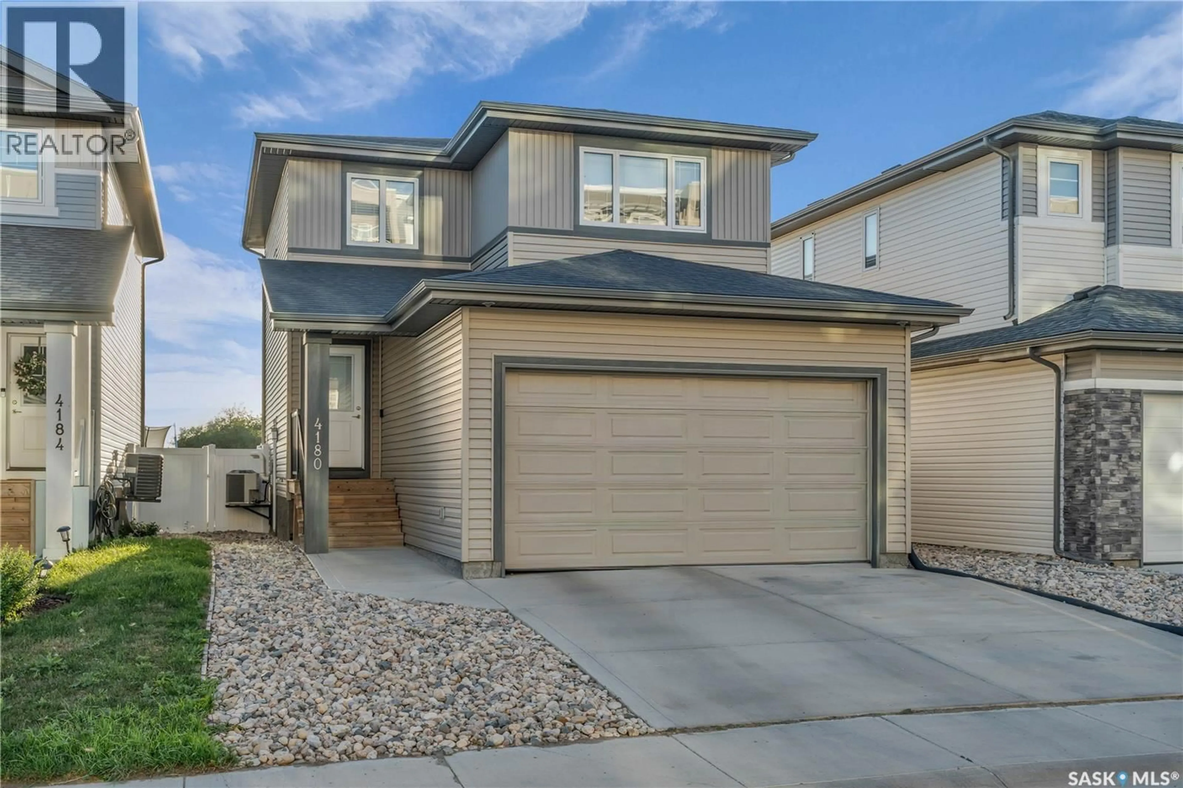Home with vinyl exterior material, street for 4180 DELHAYE WAY, Regina Saskatchewan S4W0N4