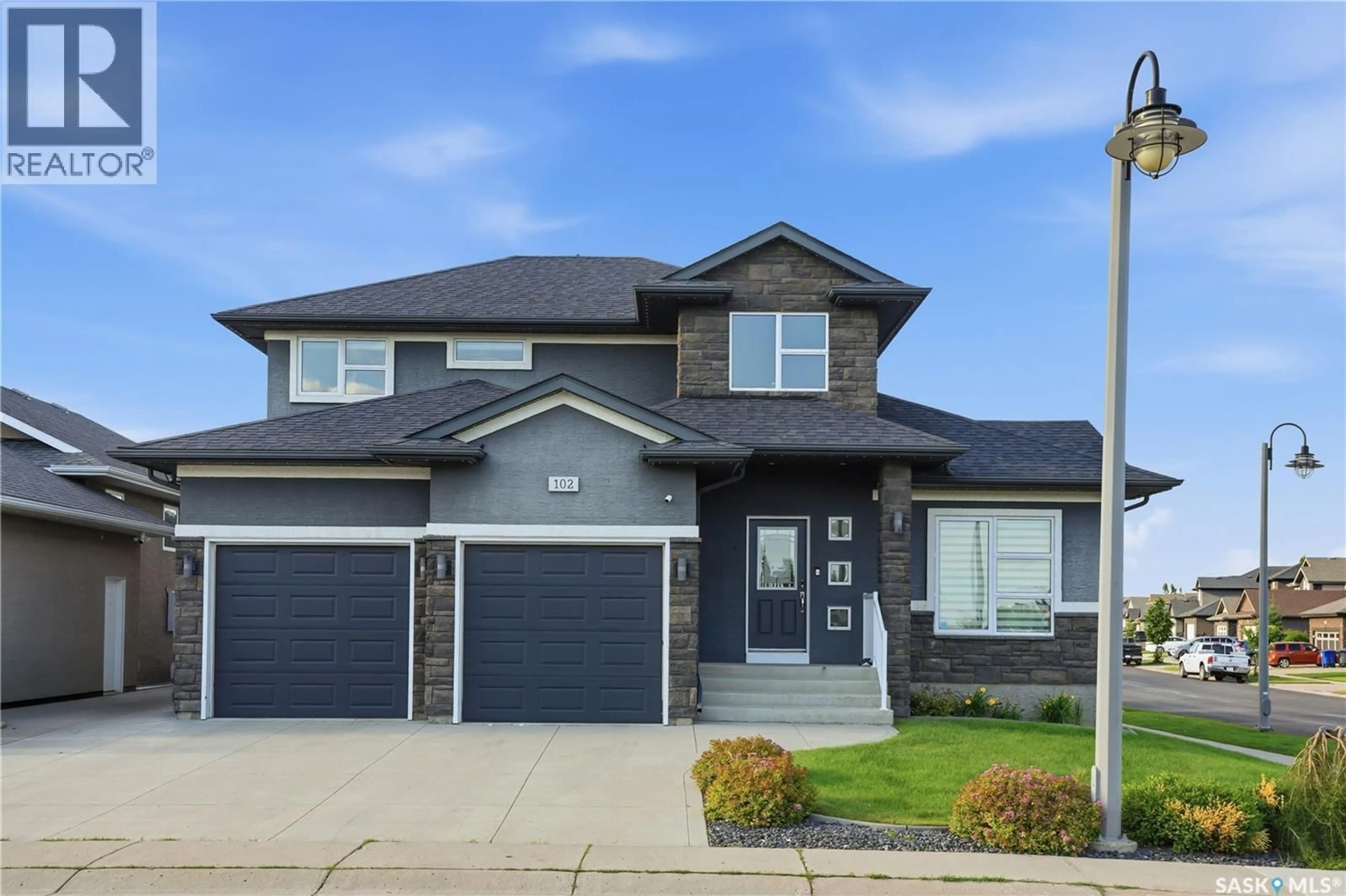 Home with vinyl exterior material, street for 102 TEAL CRESCENT, Saskatoon Saskatchewan S7T0P9