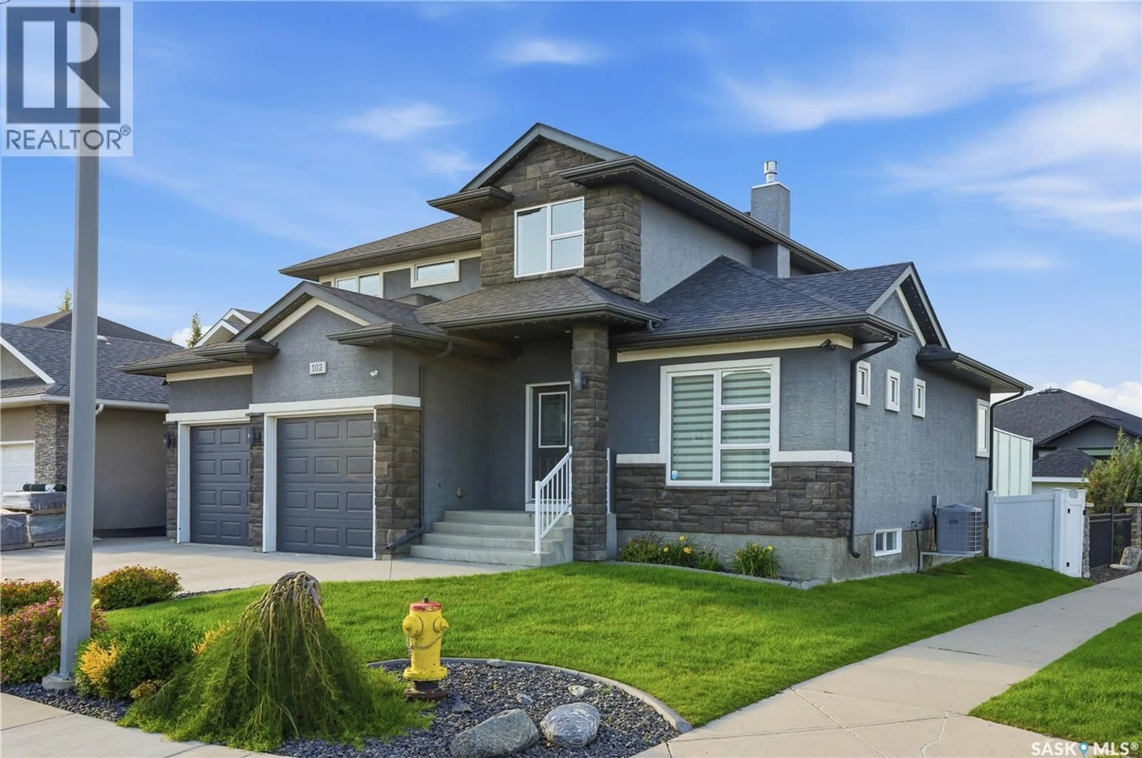 Home with vinyl exterior material, street for 102 TEAL CRESCENT, Saskatoon Saskatchewan S7T0P9