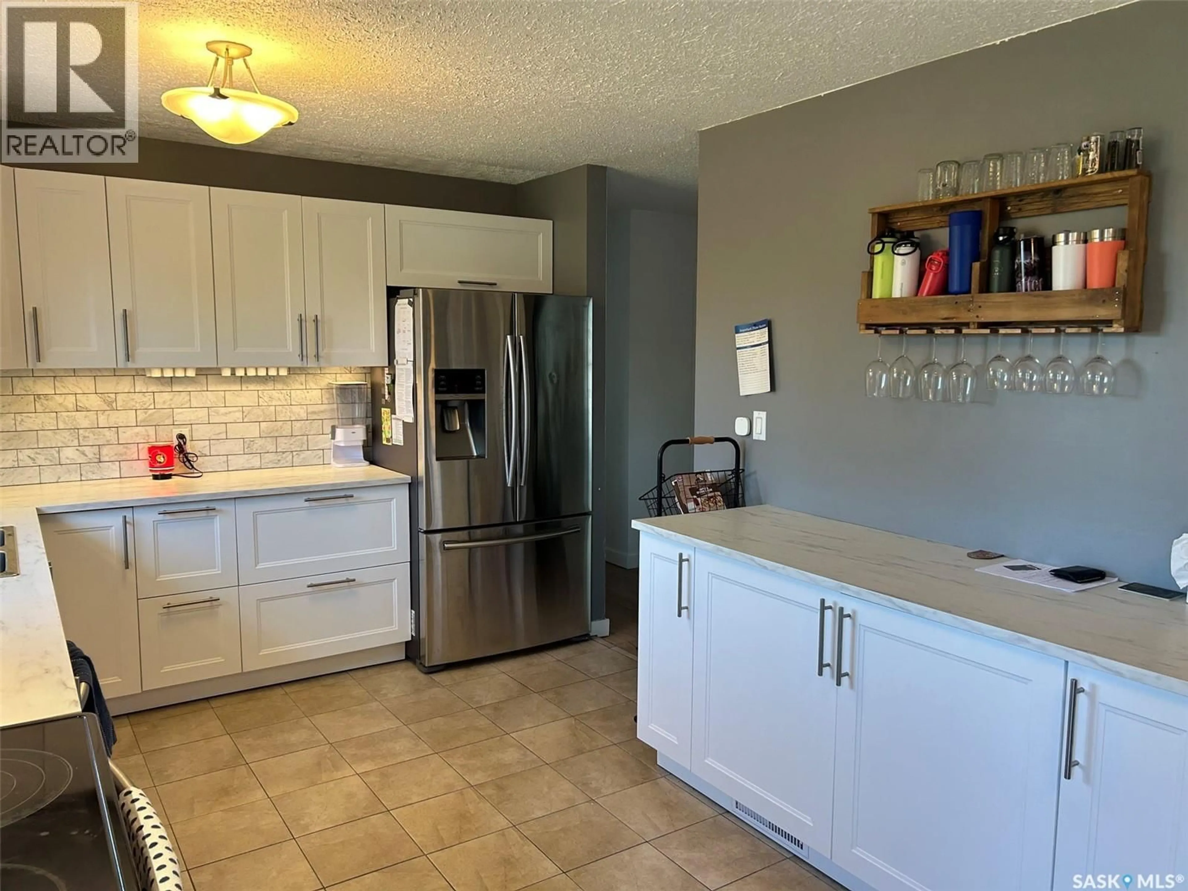 Open concept kitchen, ceramic/tile floor for 322 35TH STREET, Battleford Saskatchewan S0M0E0