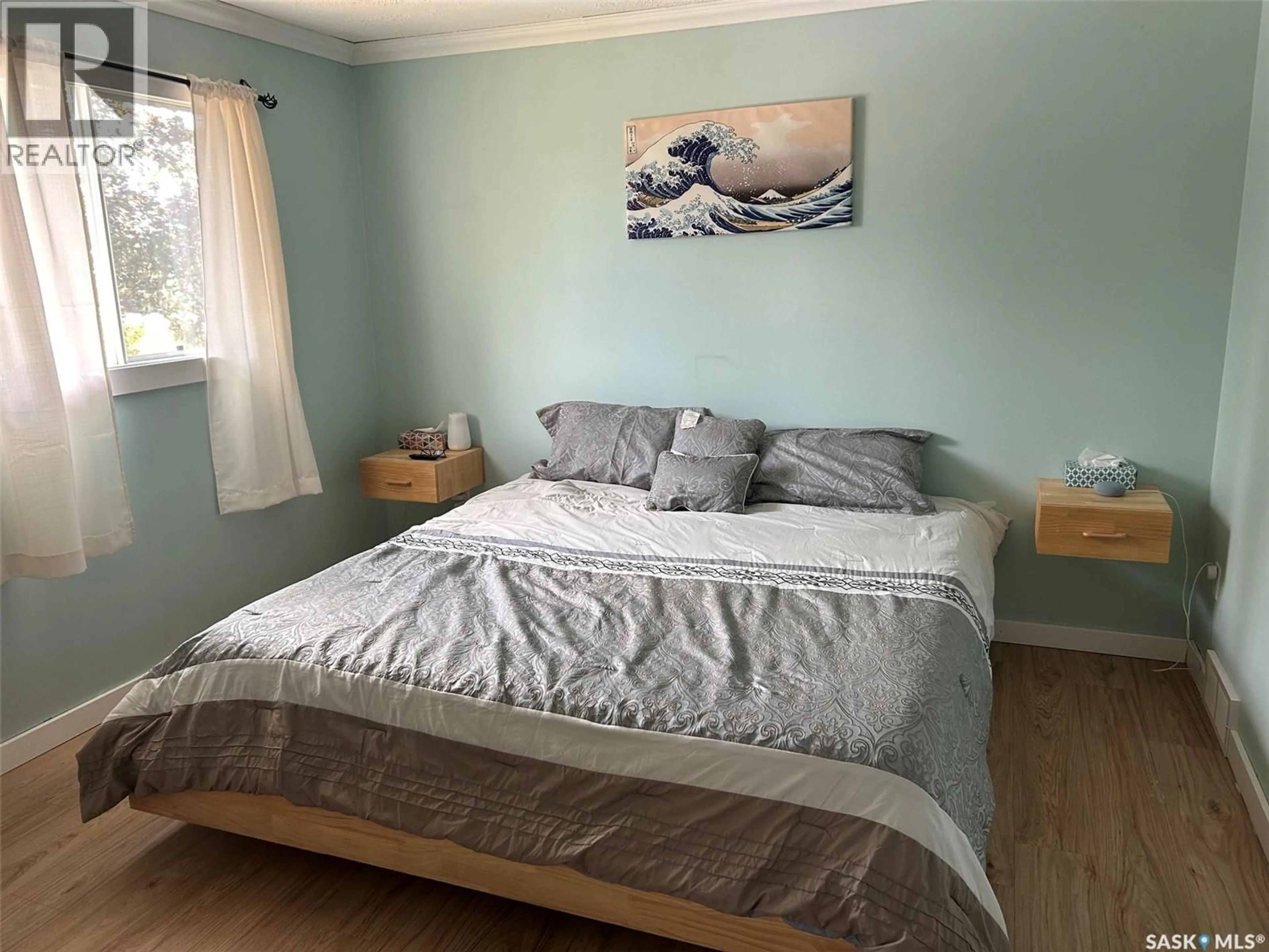 Bedroom with bed, wood/laminate floor for 322 35TH STREET, Battleford Saskatchewan S0M0E0