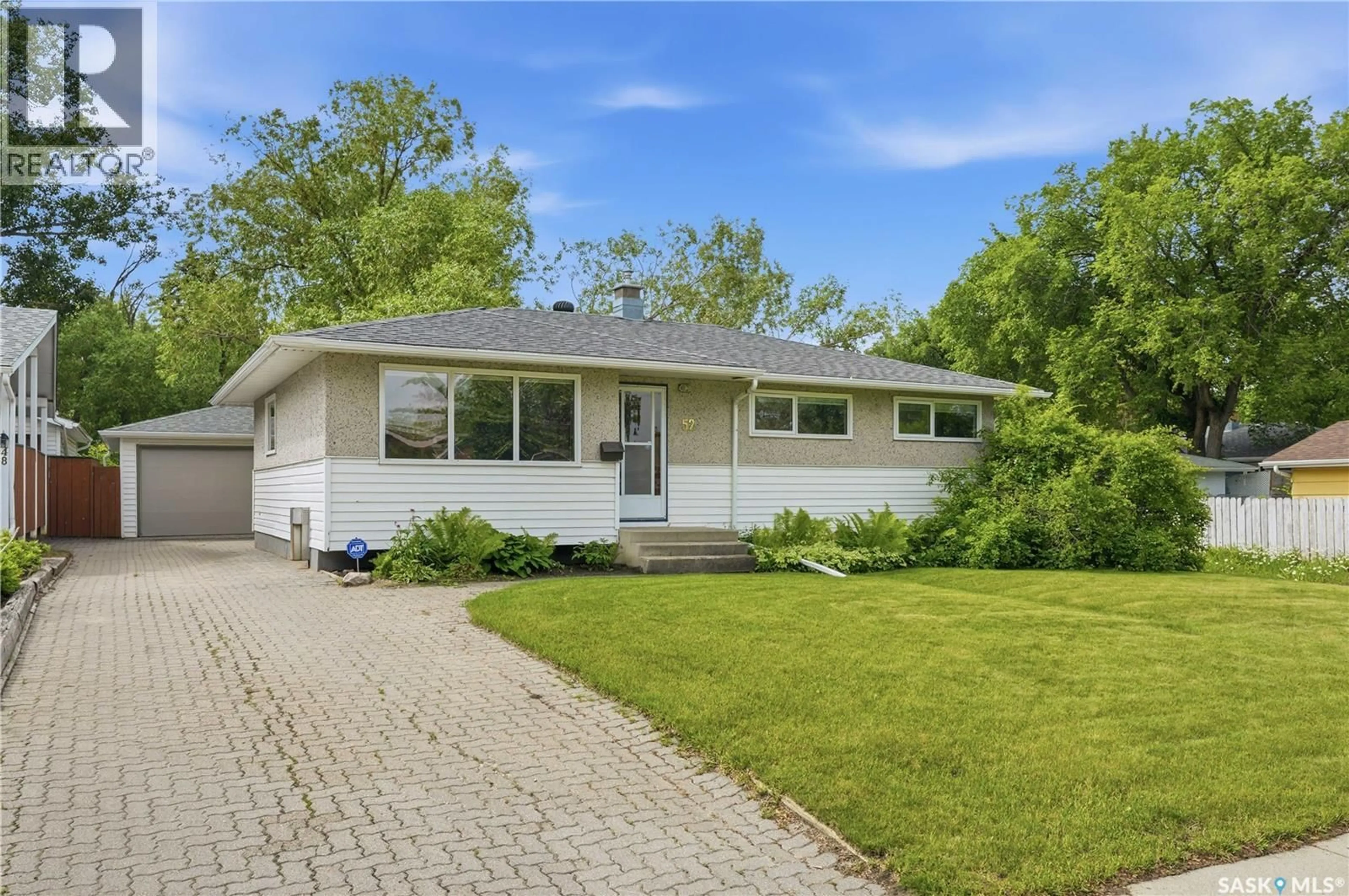 Home with vinyl exterior material, street for 52 TUCKER CRESCENT, Saskatoon Saskatchewan S7H3H5