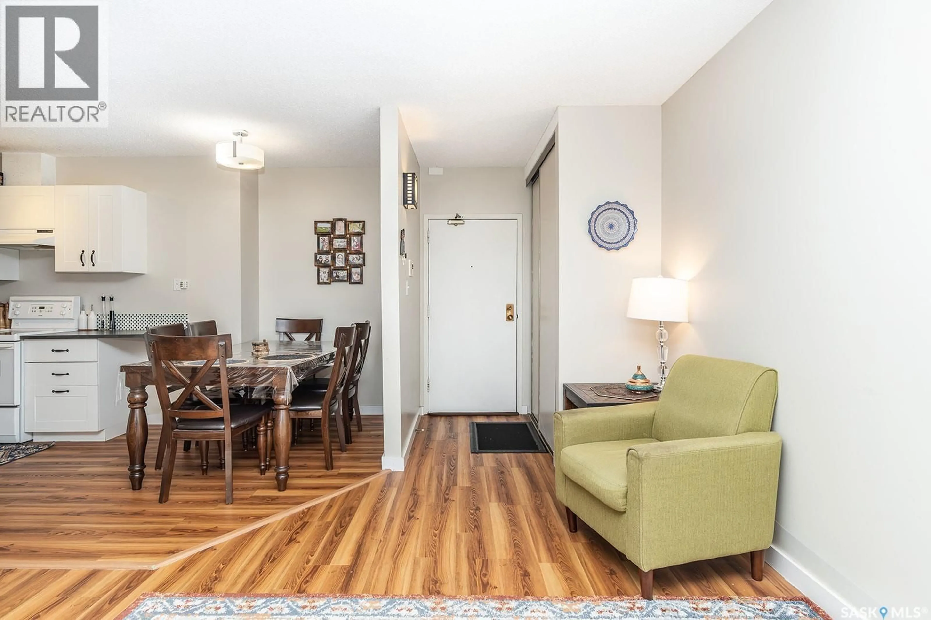 Living room with furniture, wood/laminate floor for 312 423 TAIT COURT, Saskatoon Saskatchewan S7H5L3