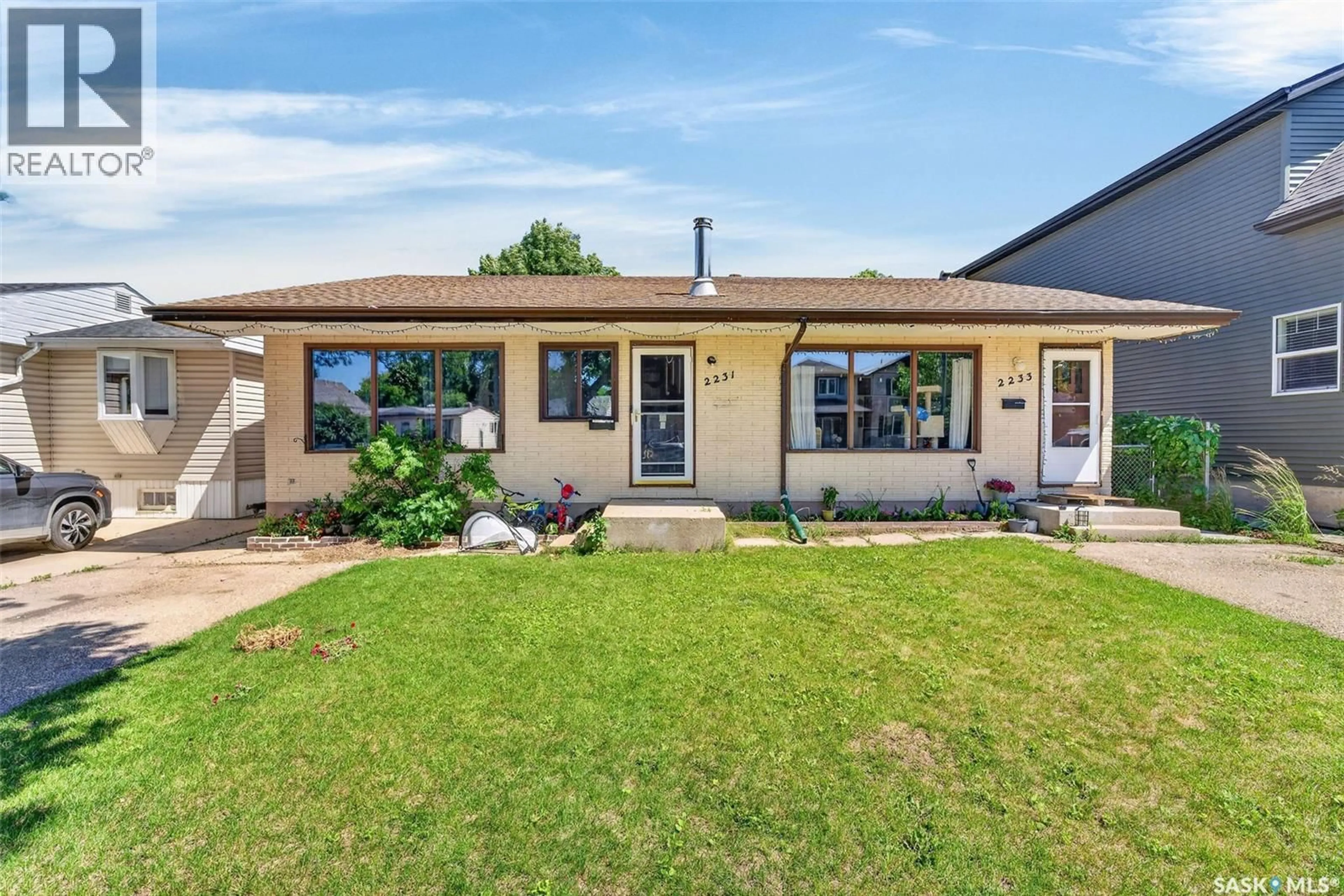Home with vinyl exterior material, street for 2231-2233 ST ANDREWS AVENUE, Saskatoon Saskatchewan S7M0M4
