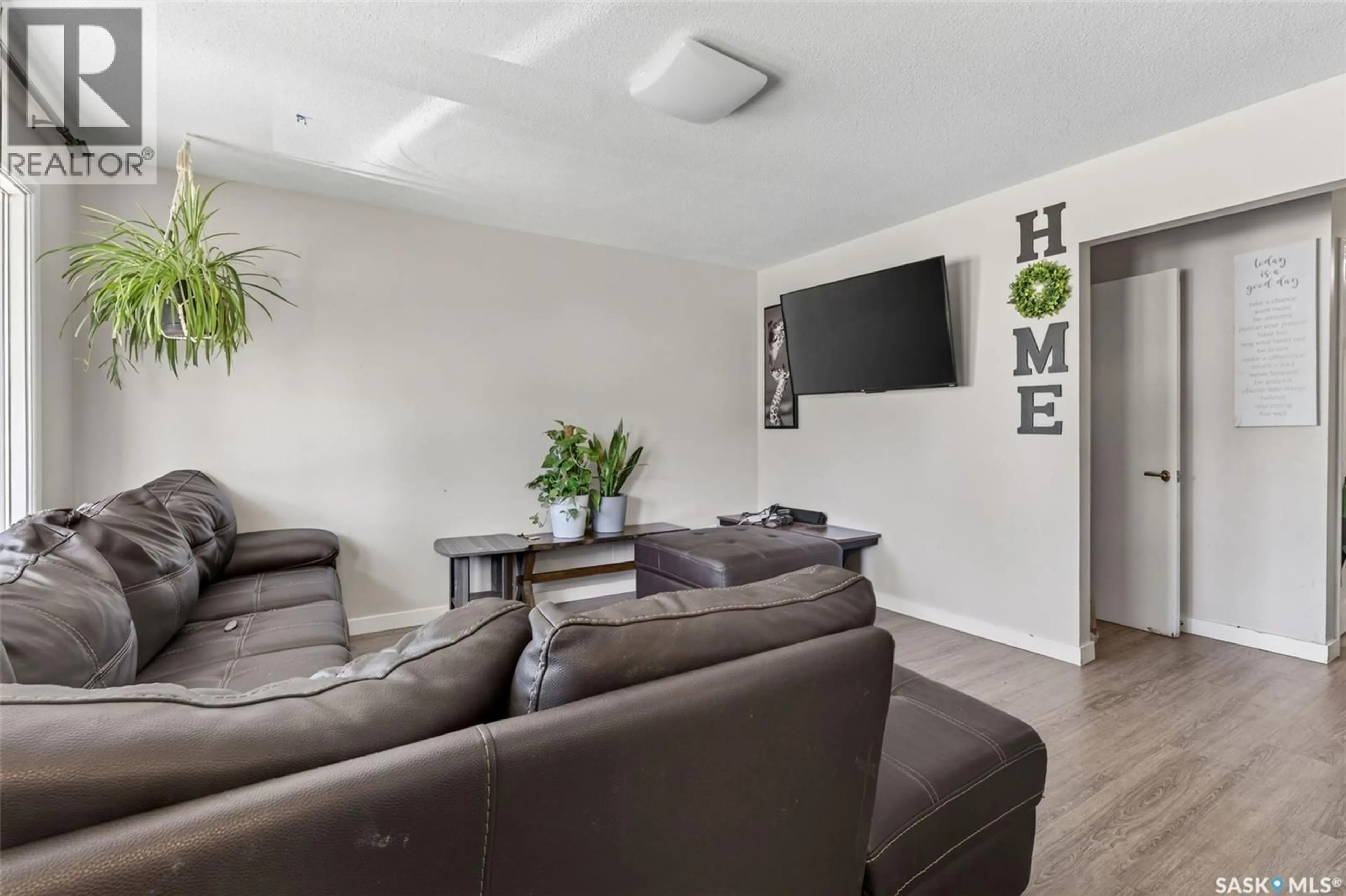 Living room with furniture, unknown for 2231-2233 ST ANDREWS AVENUE, Saskatoon Saskatchewan S7M0M4
