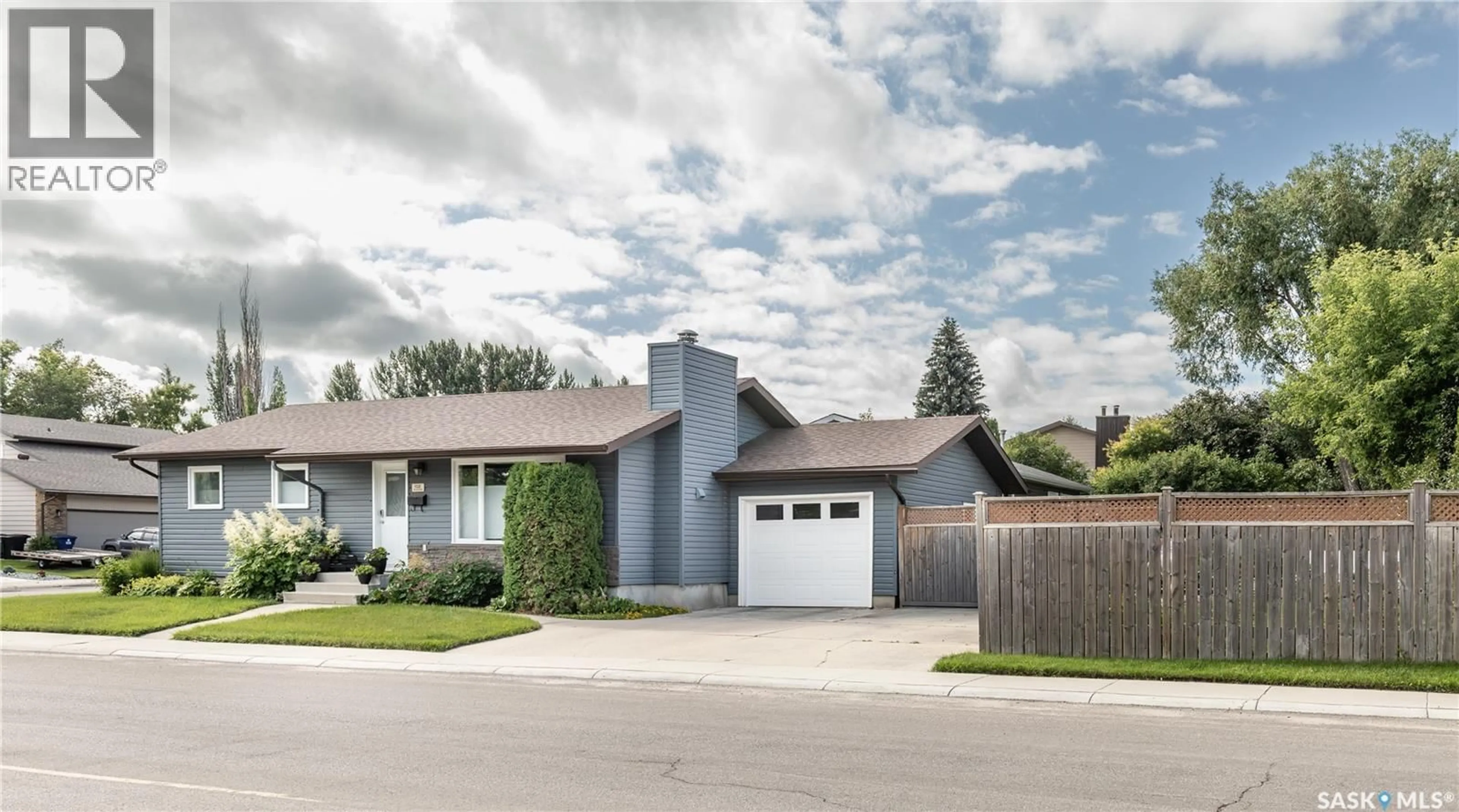 Home with brick exterior material, street for 102 WAKAW CRESCENT, Saskatoon Saskatchewan S7J4E2