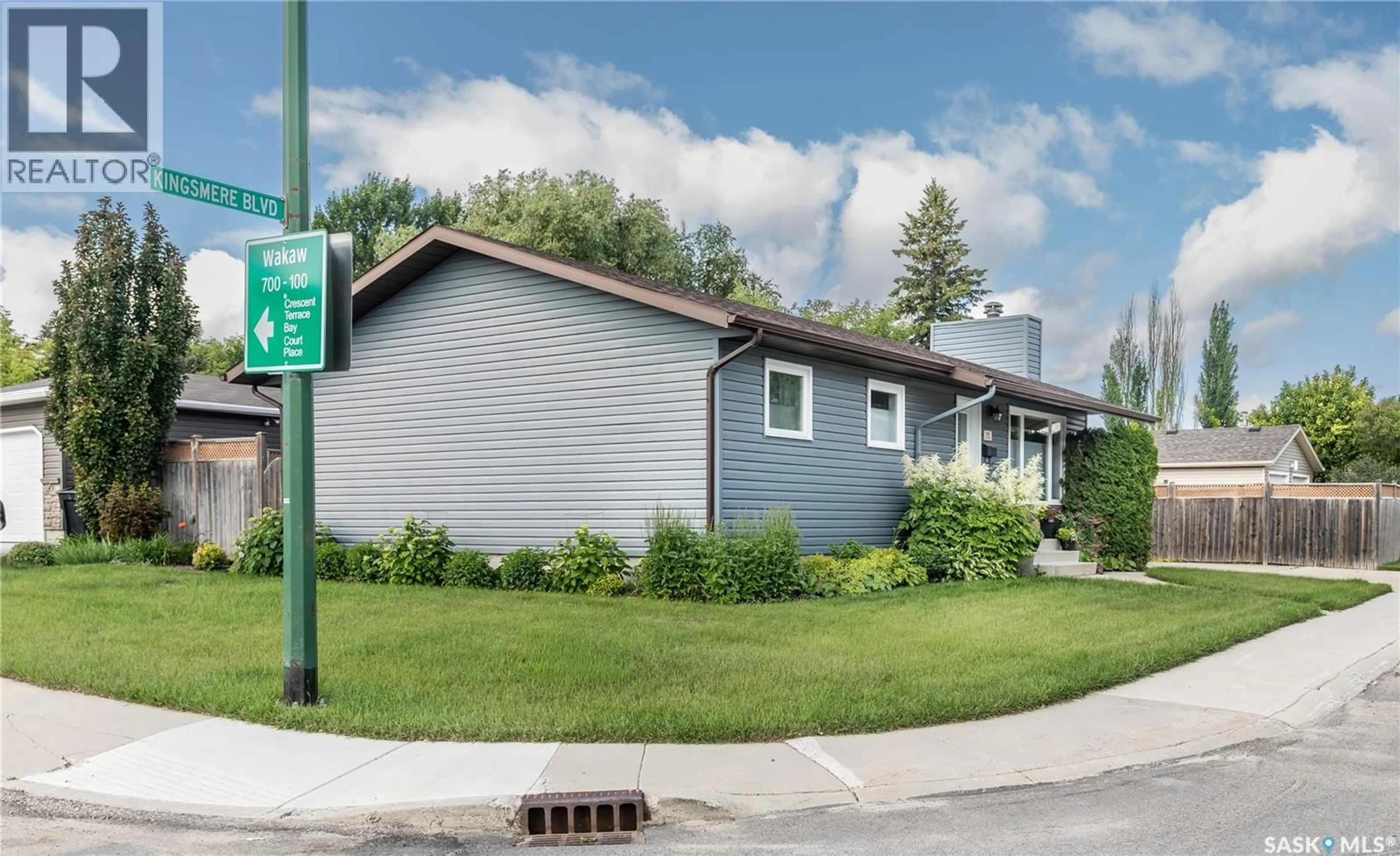 Home with vinyl exterior material, street for 102 WAKAW CRESCENT, Saskatoon Saskatchewan S7J4E2