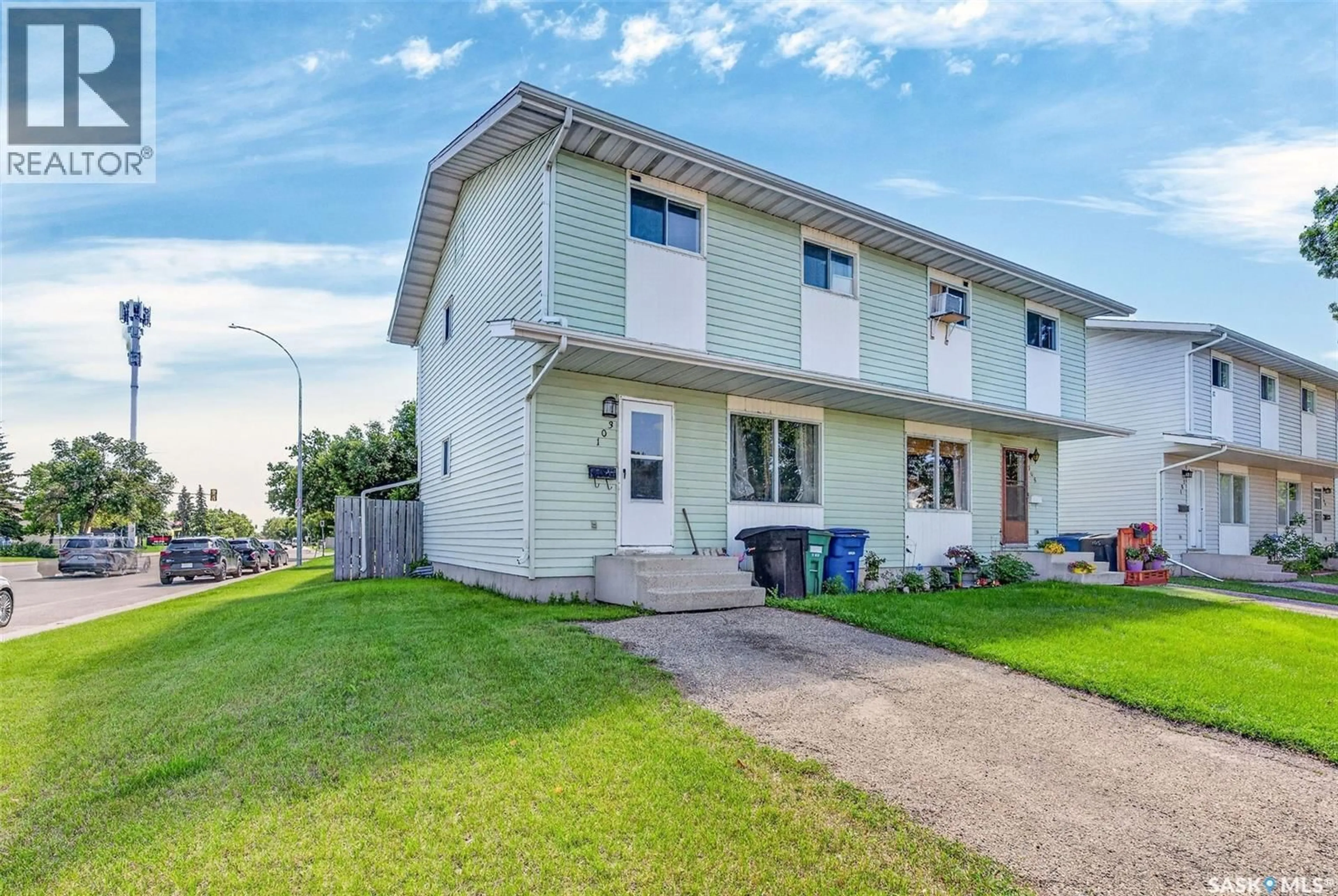 Home with vinyl exterior material, street for 103-105 DAVIES ROAD, Saskatoon Saskatchewan S7K7L4