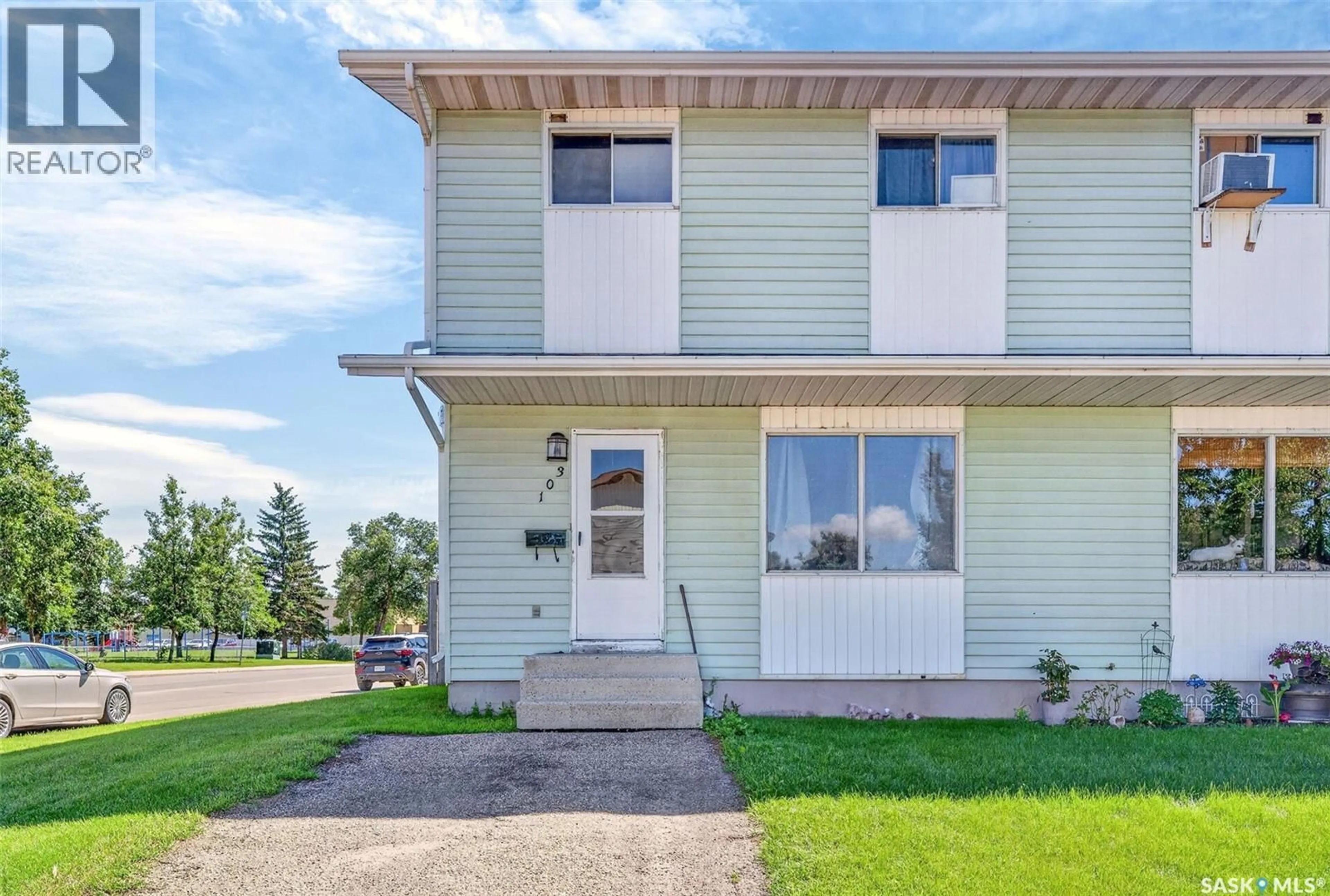 Home with vinyl exterior material, street for 103-105 DAVIES ROAD, Saskatoon Saskatchewan S7K7L4