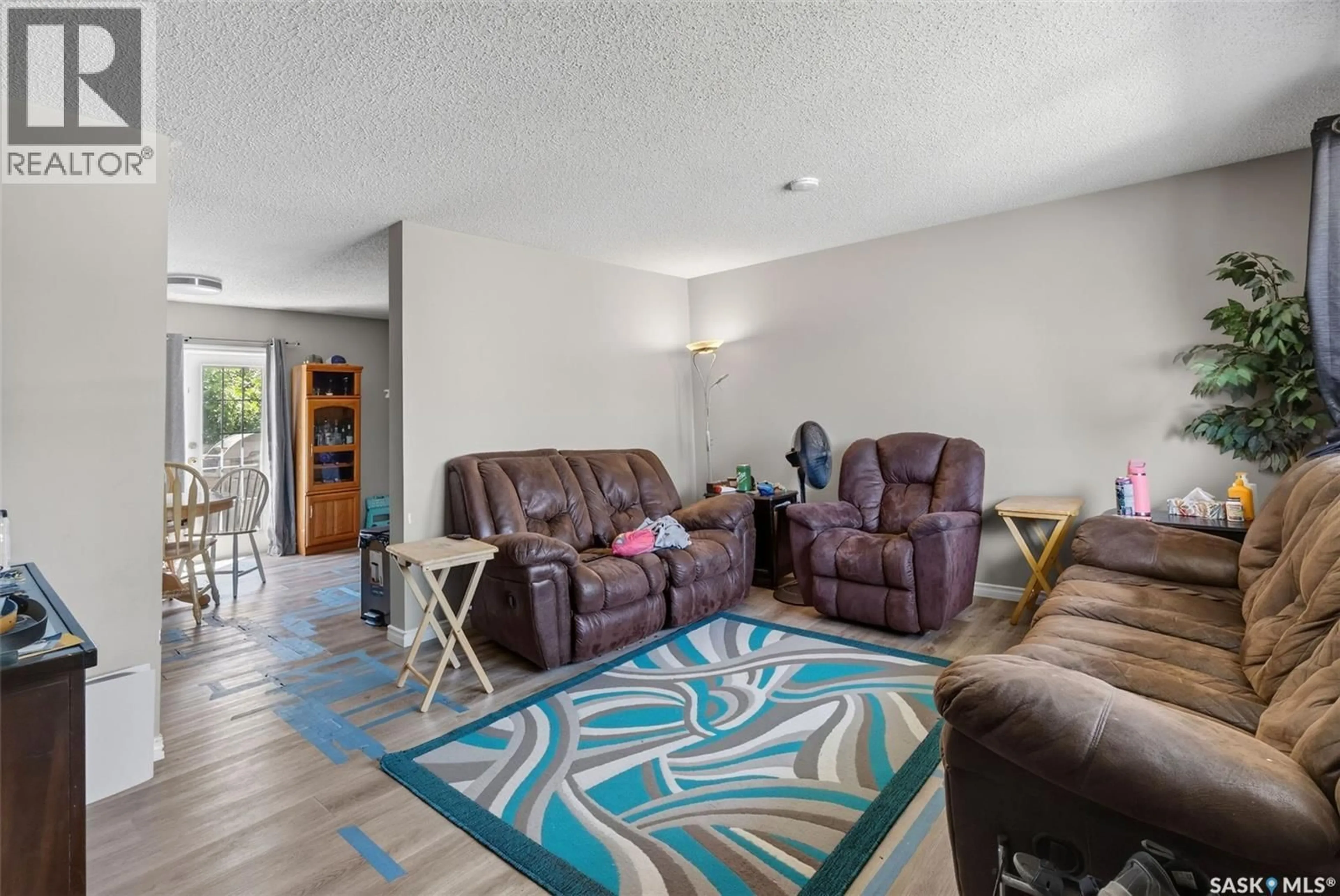 Living room with furniture, unknown for 103-105 DAVIES ROAD, Saskatoon Saskatchewan S7K7L4