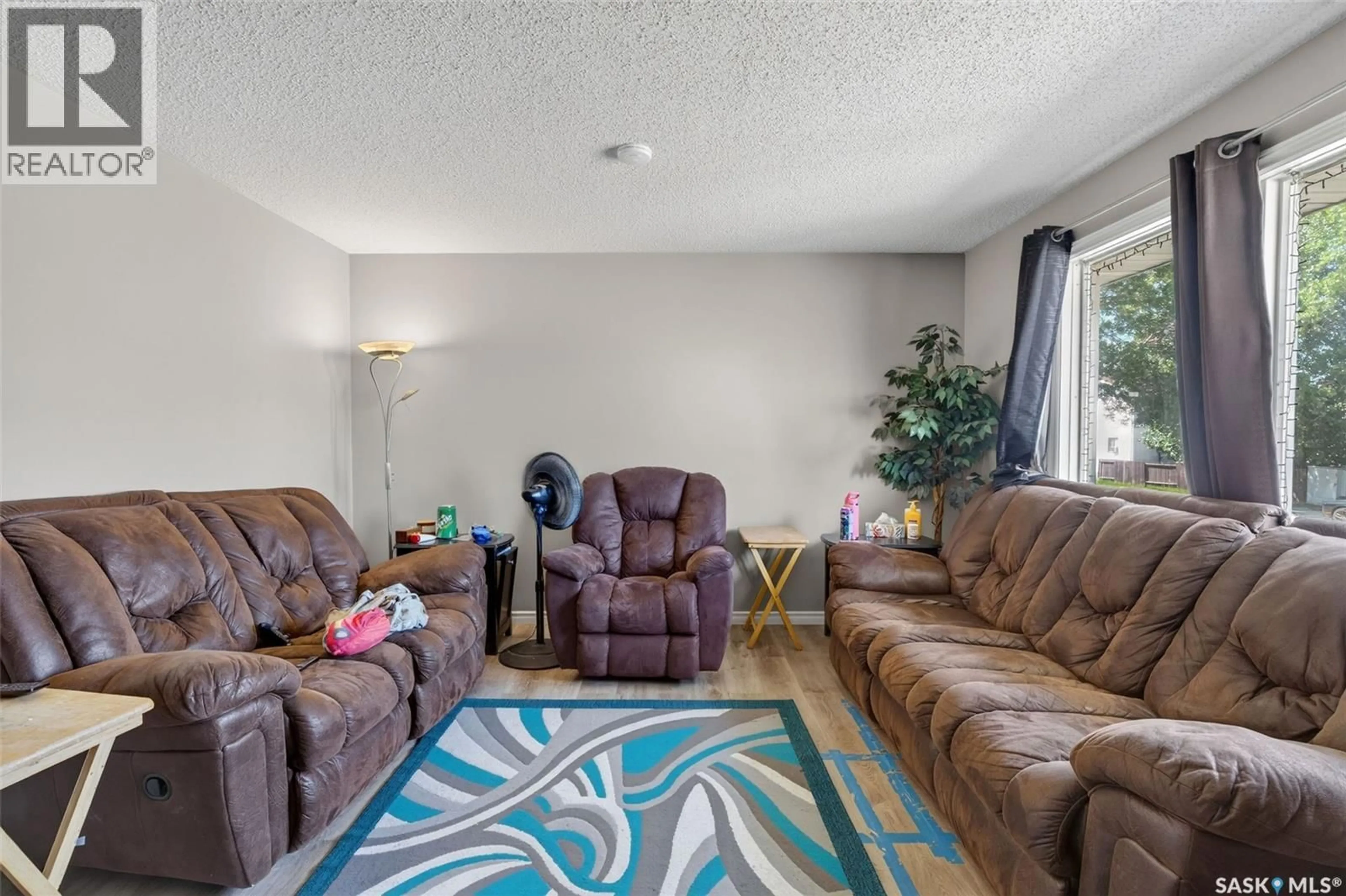 Living room with furniture, unknown for 103-105 DAVIES ROAD, Saskatoon Saskatchewan S7K7L4