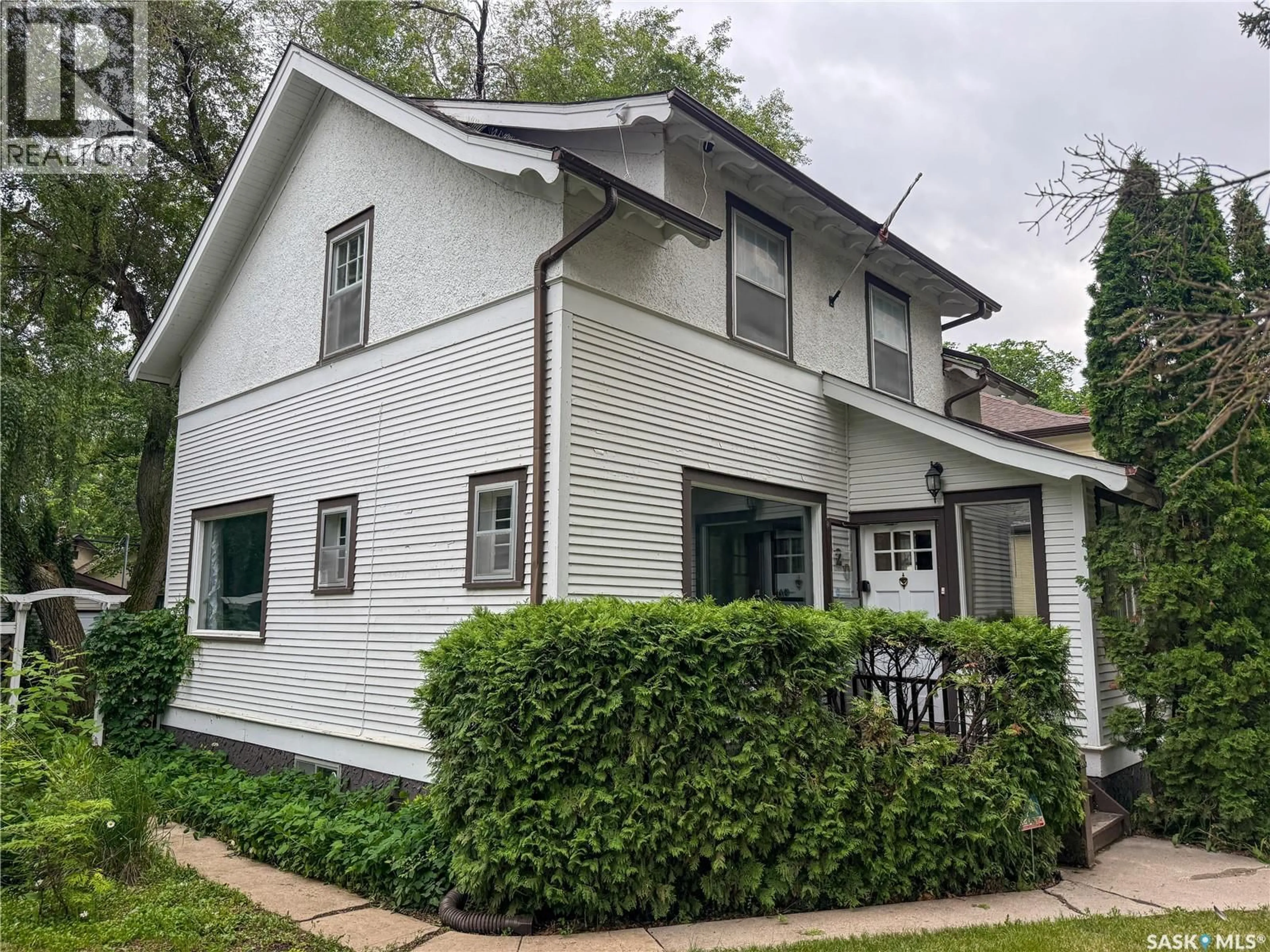 Home with vinyl exterior material, street for 120 8TH STREET, Saskatoon Saskatchewan S7H0N9