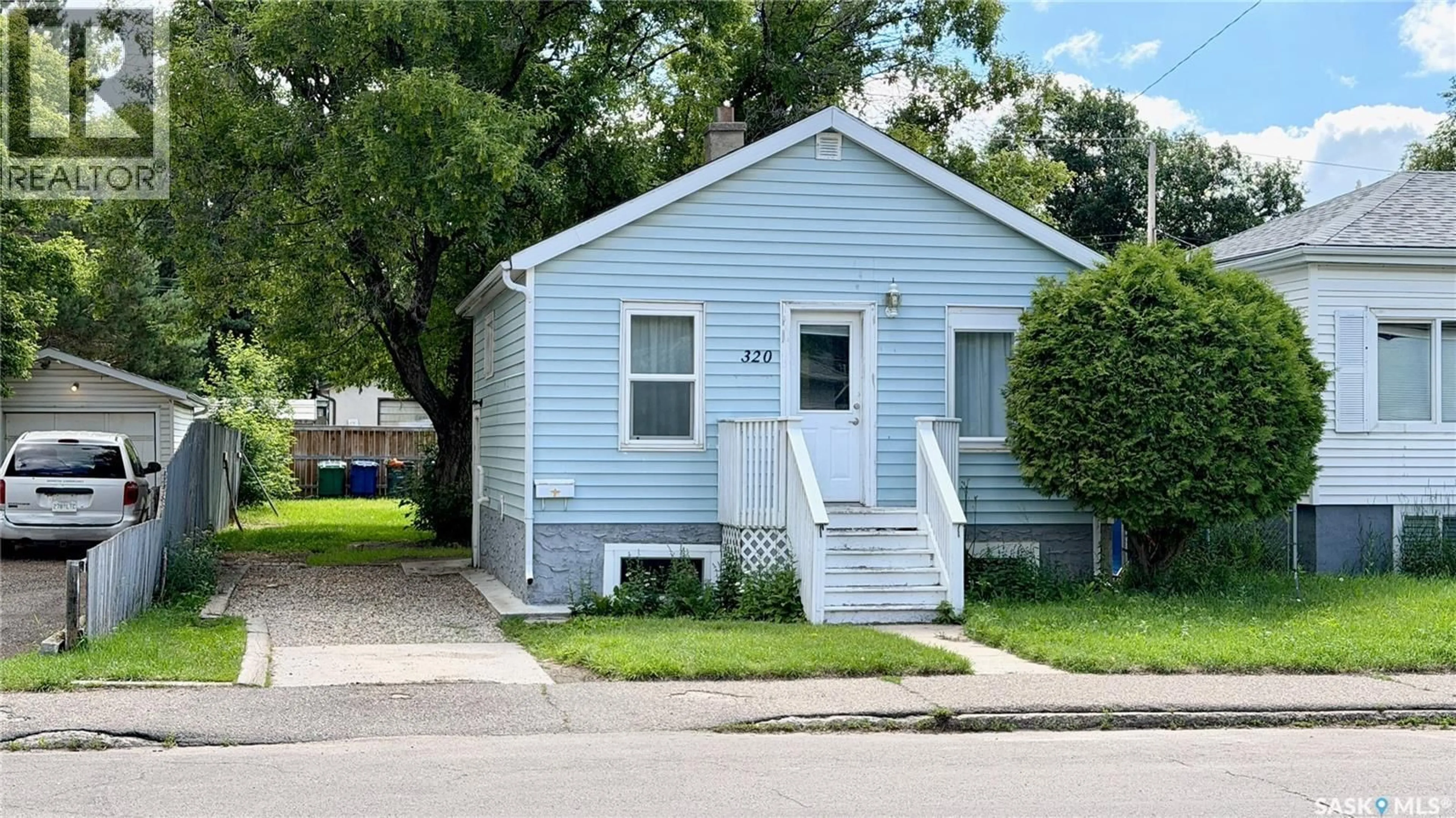 Home with vinyl exterior material, street for 320 M AVENUE, Saskatoon Saskatchewan S7L2S5