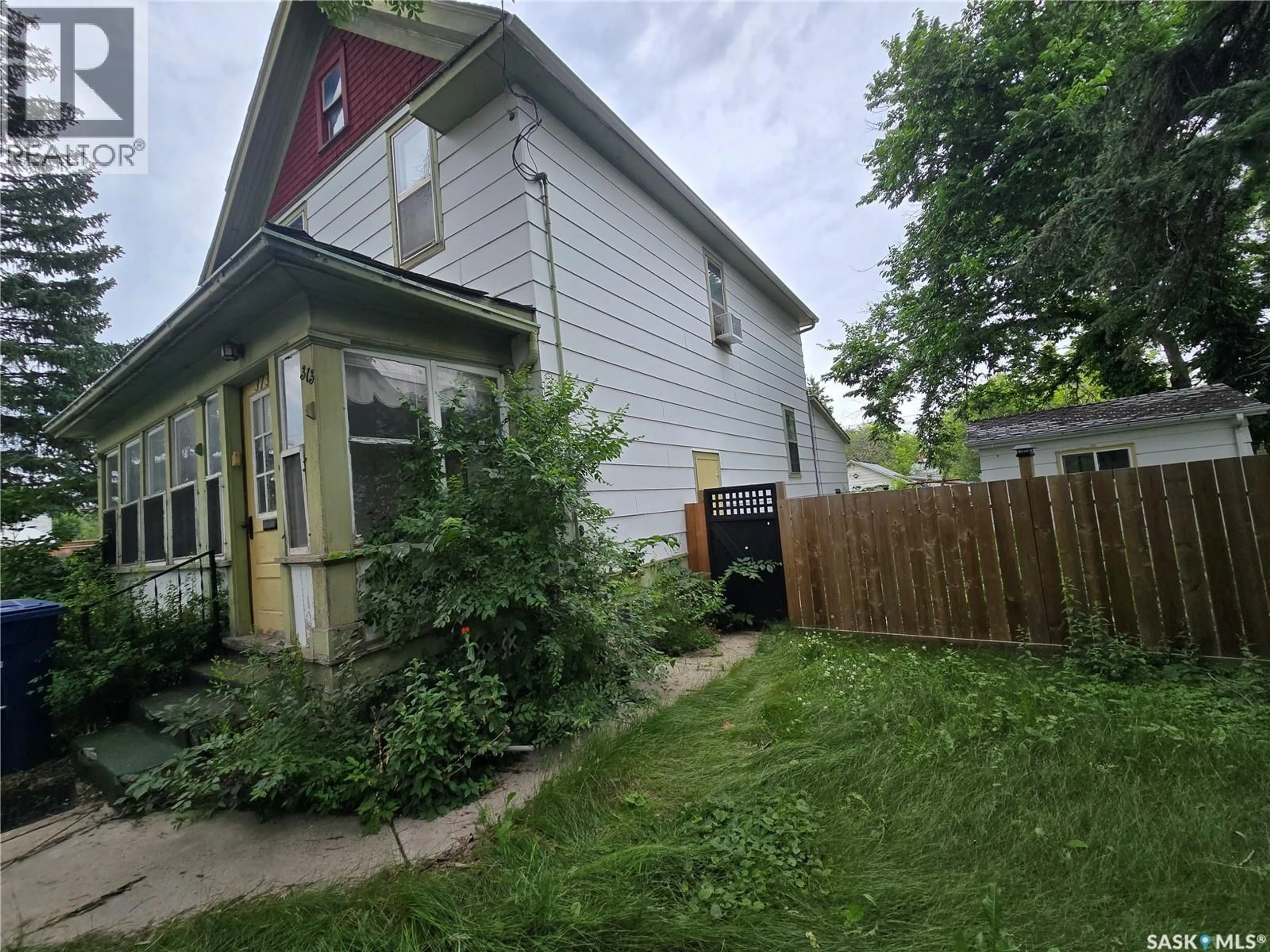 A pic from outside/outdoor area/front of a property/back of a property/a pic from drone, street for 313 3RD AVENUE, Weyburn Saskatchewan S4H1X5