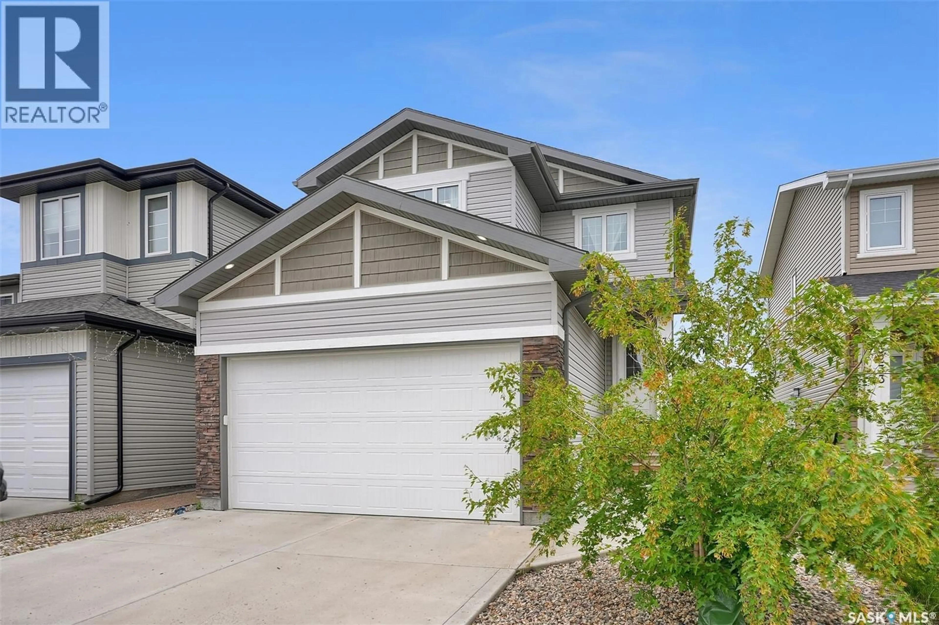 Home with vinyl exterior material, street for 3229 GREEN WATER DRIVE, Regina Saskatchewan S4V3R6