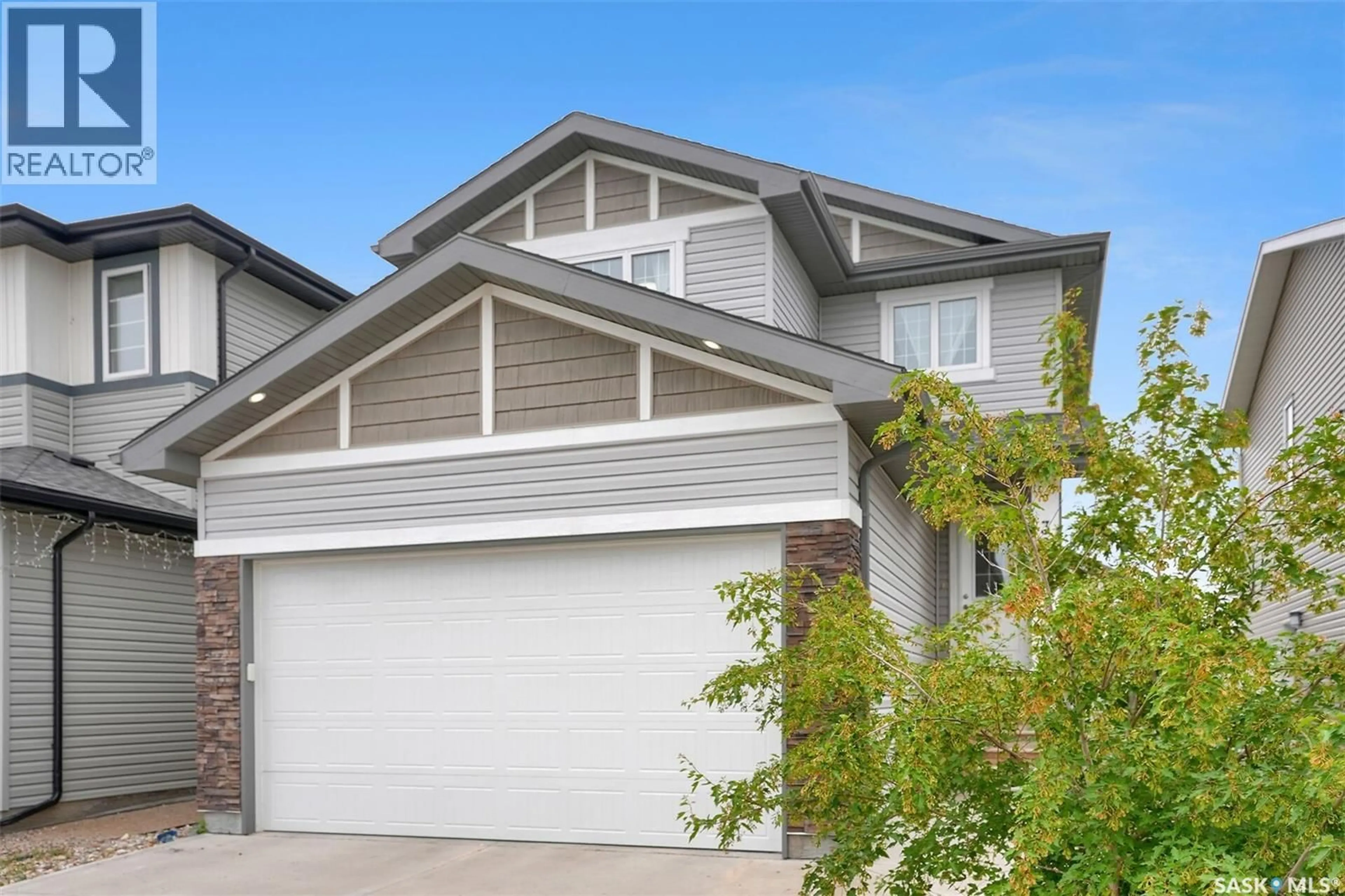 Home with vinyl exterior material, street for 3229 GREEN WATER DRIVE, Regina Saskatchewan S4V3R6