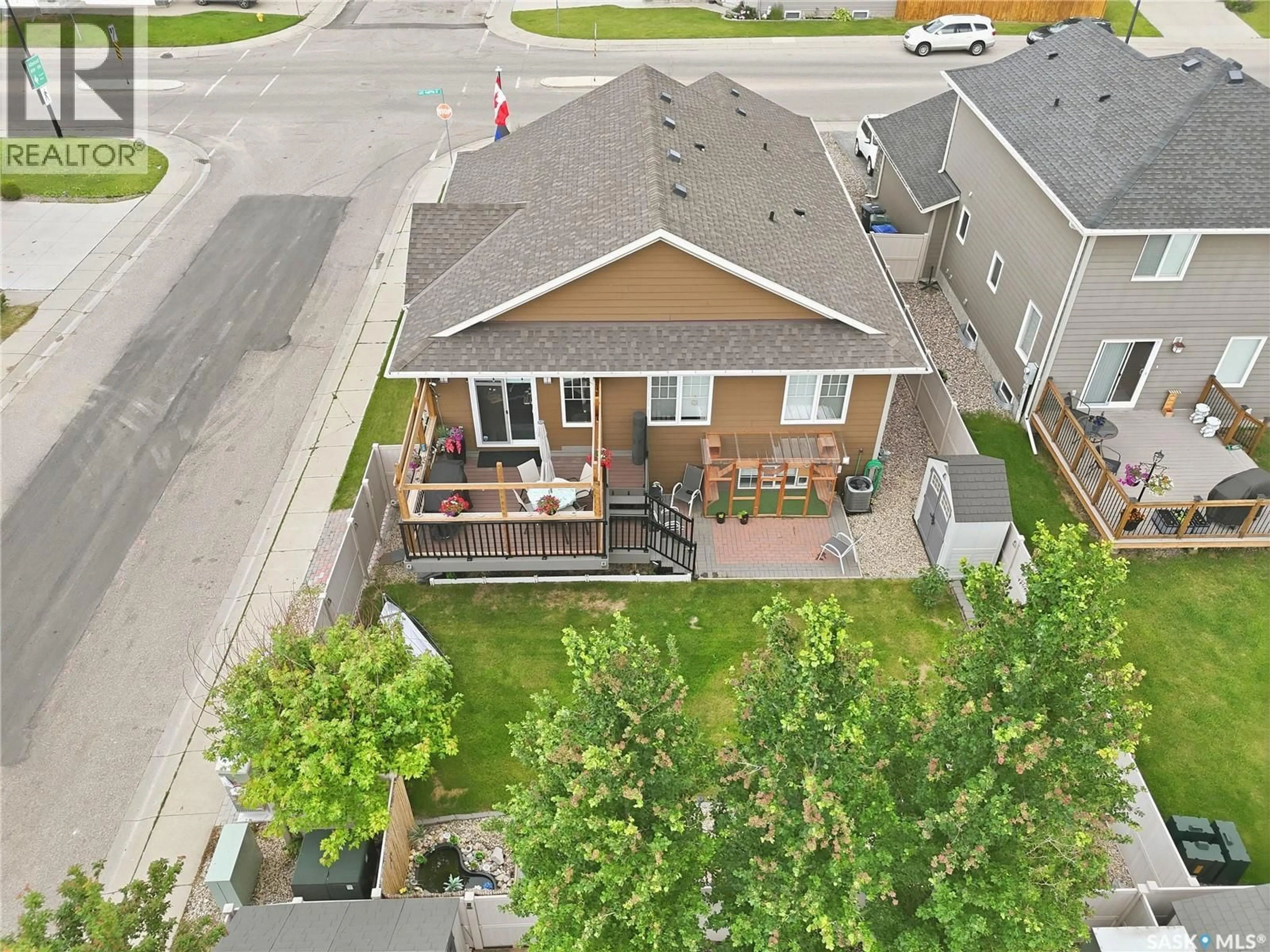 A pic from outside/outdoor area/front of a property/back of a property/a pic from drone, street for E - 303 EAST HAMPTON BOULEVARD, Saskatoon Saskatchewan S7R0A5