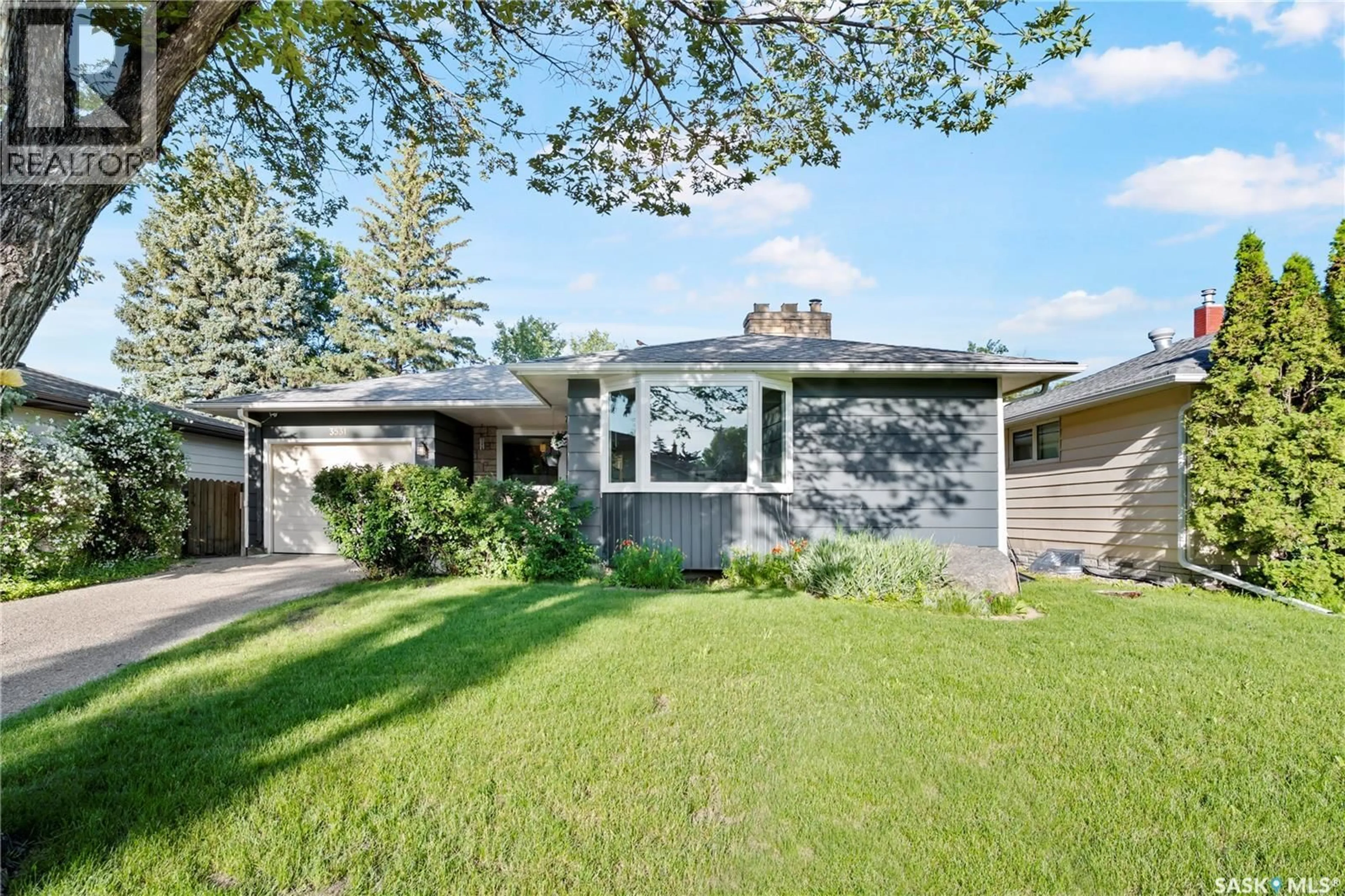 Home with vinyl exterior material, street for 3531 QUEEN STREET, Regina Saskatchewan S4S2G1
