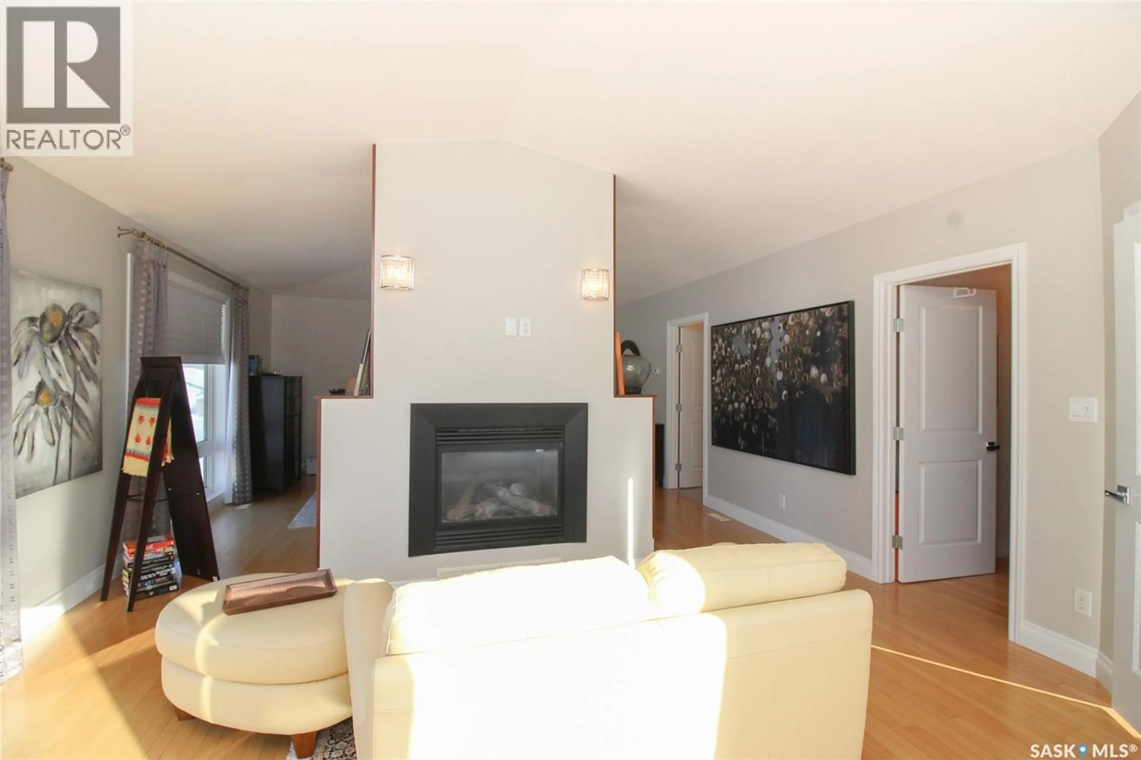 Living room with furniture, wood/laminate floor for 555 5TH STREET, Shaunavon Saskatchewan S0N2M0