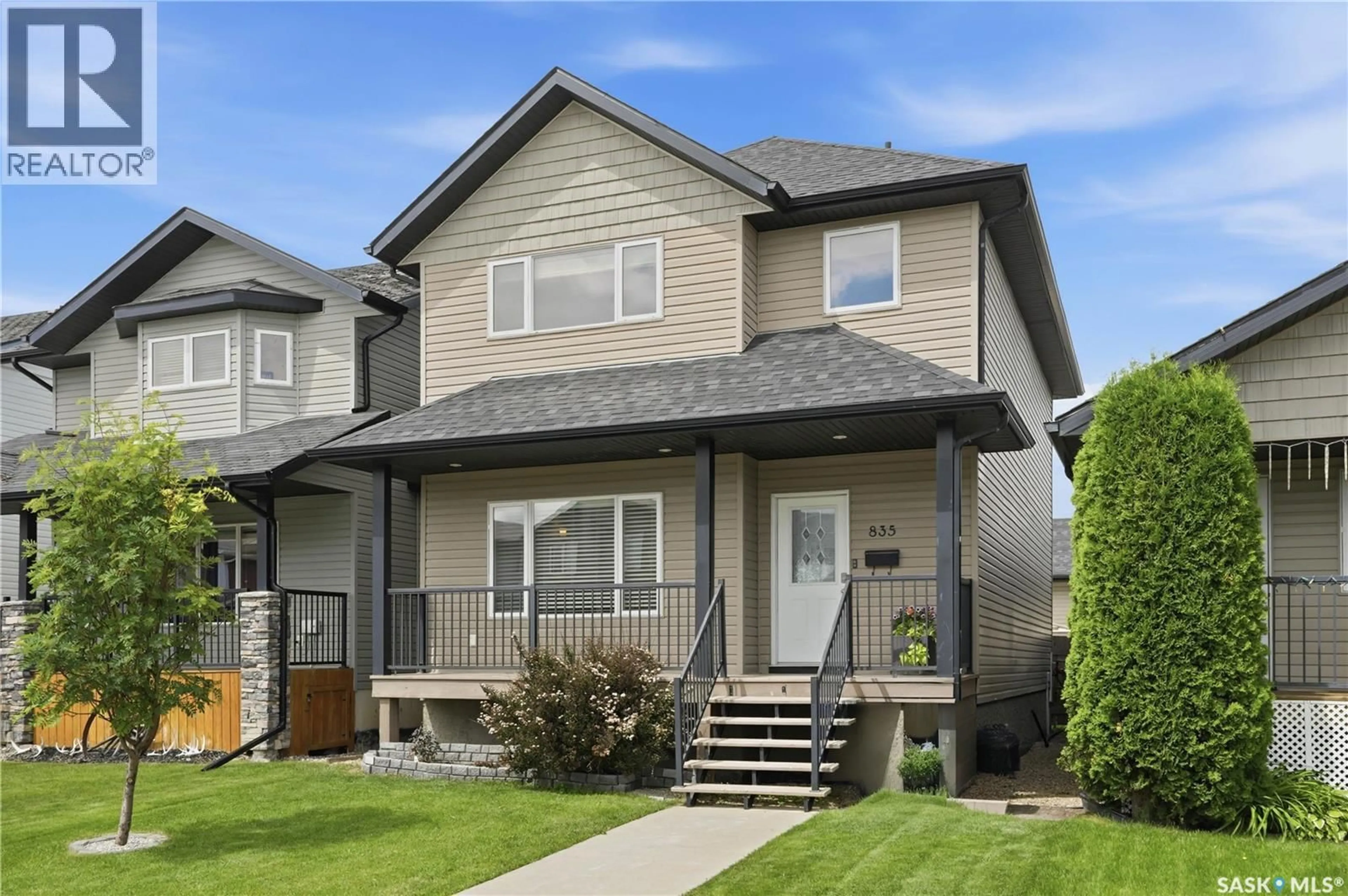 Home with vinyl exterior material, street for 835 LAMARSH LANE, Saskatoon Saskatchewan S7W1B7