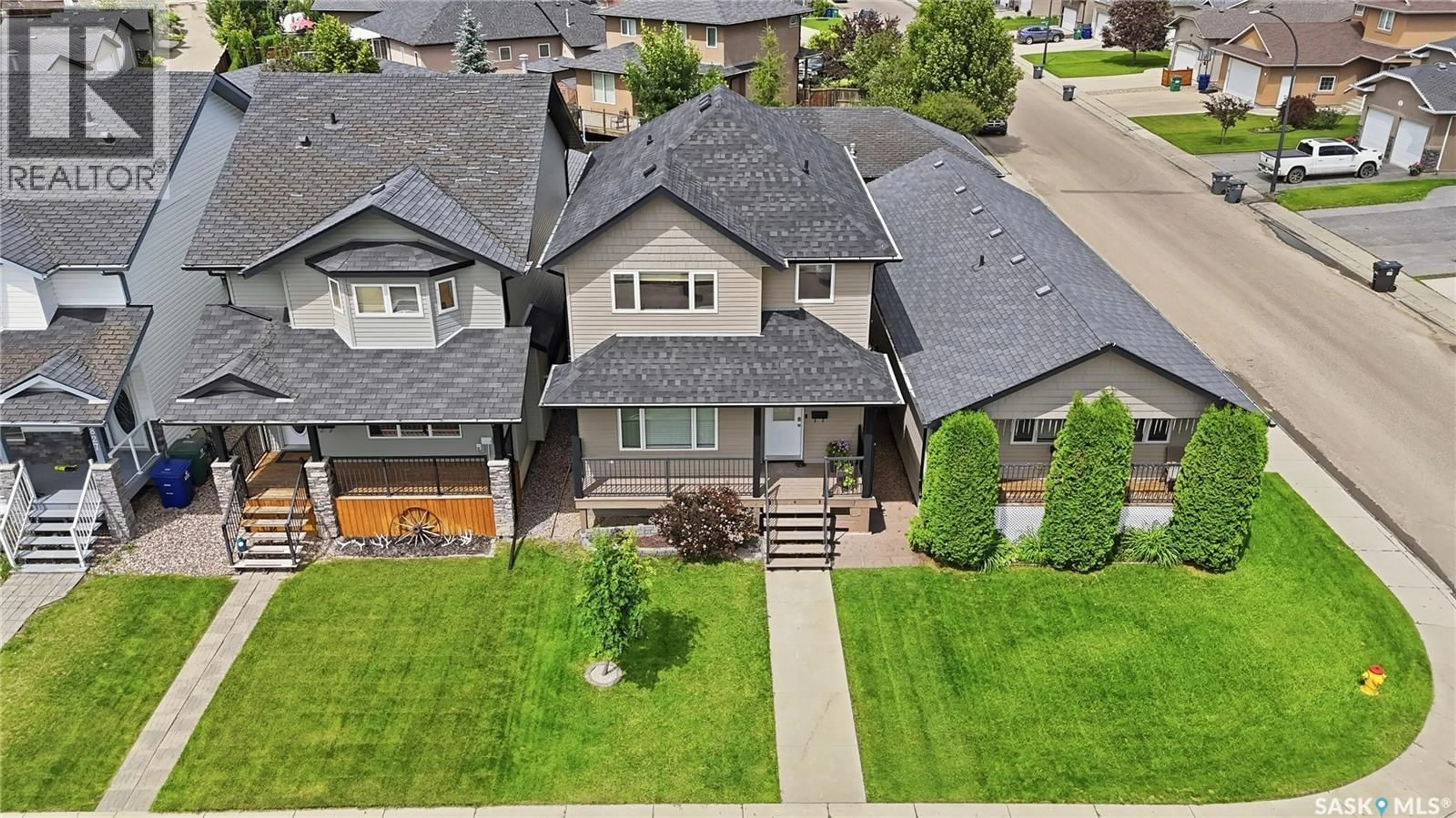 A pic from outside/outdoor area/front of a property/back of a property/a pic from drone, street for 835 LAMARSH LANE, Saskatoon Saskatchewan S7W1B7