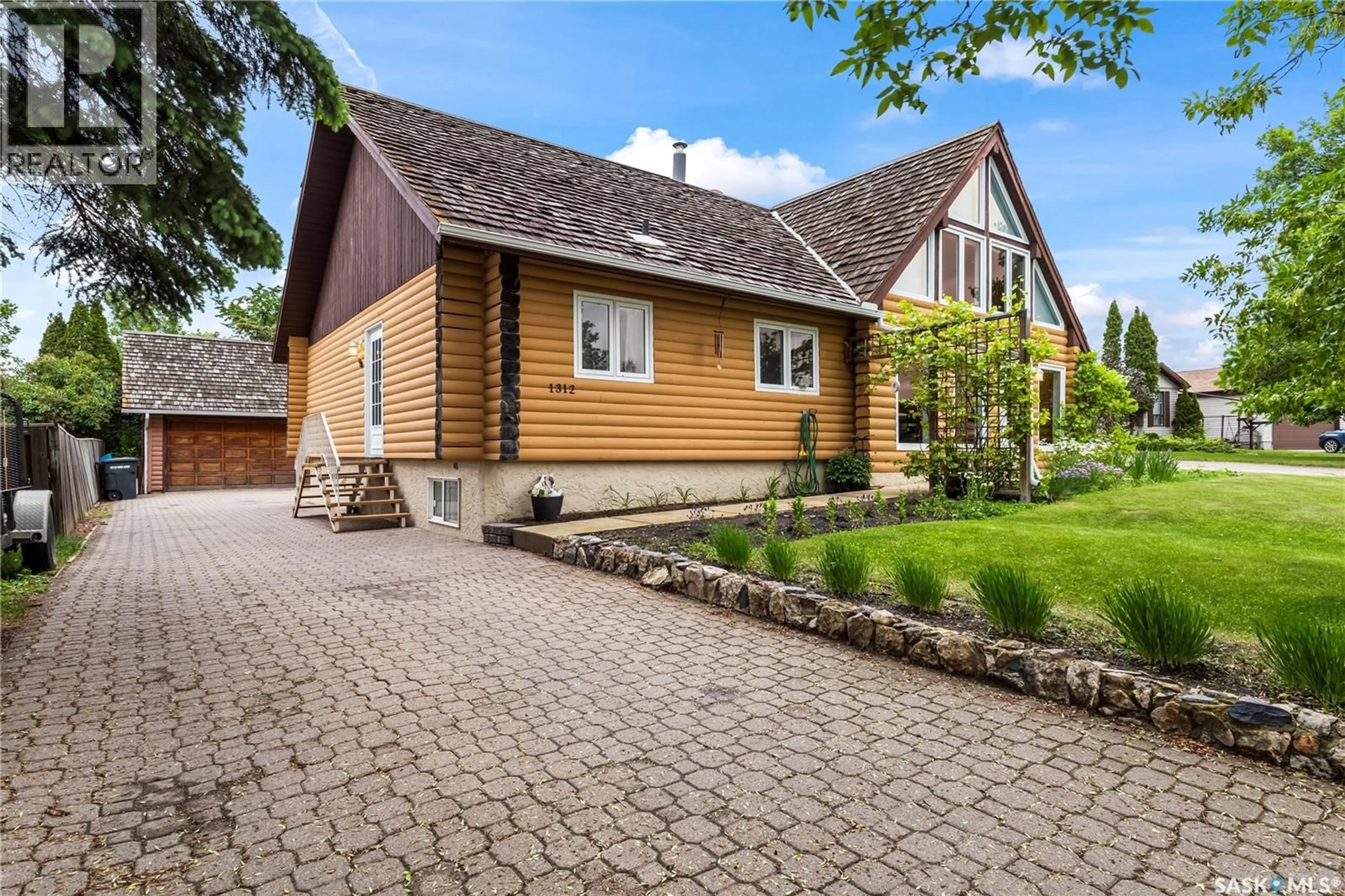 Home with brick exterior material, street for 1312 REED BAY, Prince Albert Saskatchewan S6V6R4