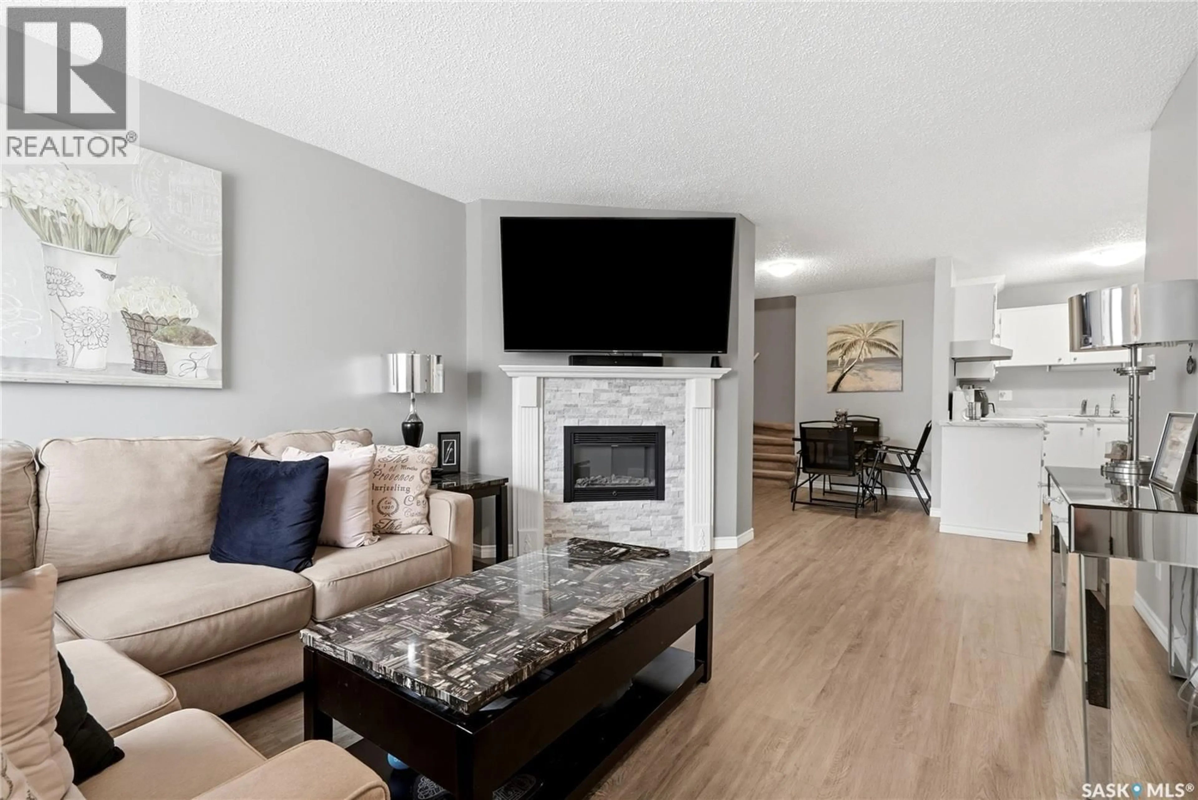 Living room with furniture, wood/laminate floor for 134 CEDAR MEADOW DRIVE, Regina Saskatchewan S4X3J6